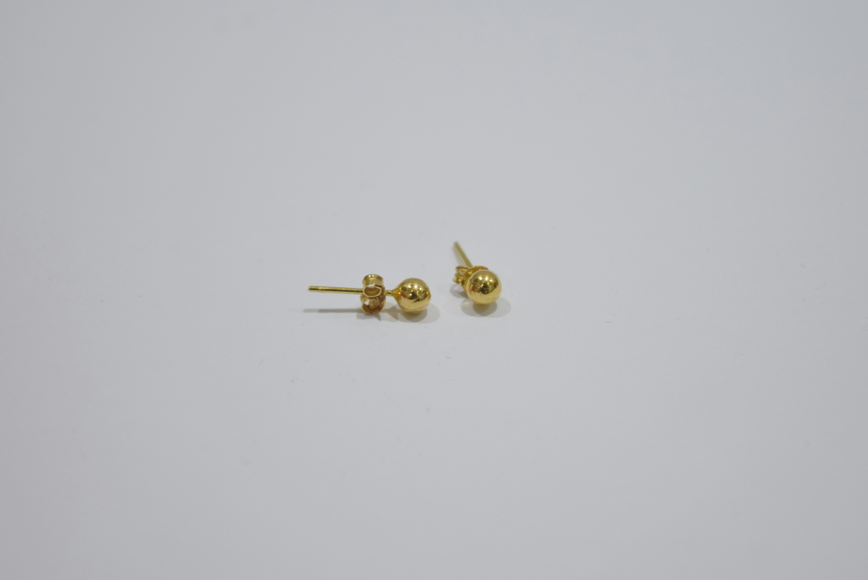 Pair of small gold ball stud earrings