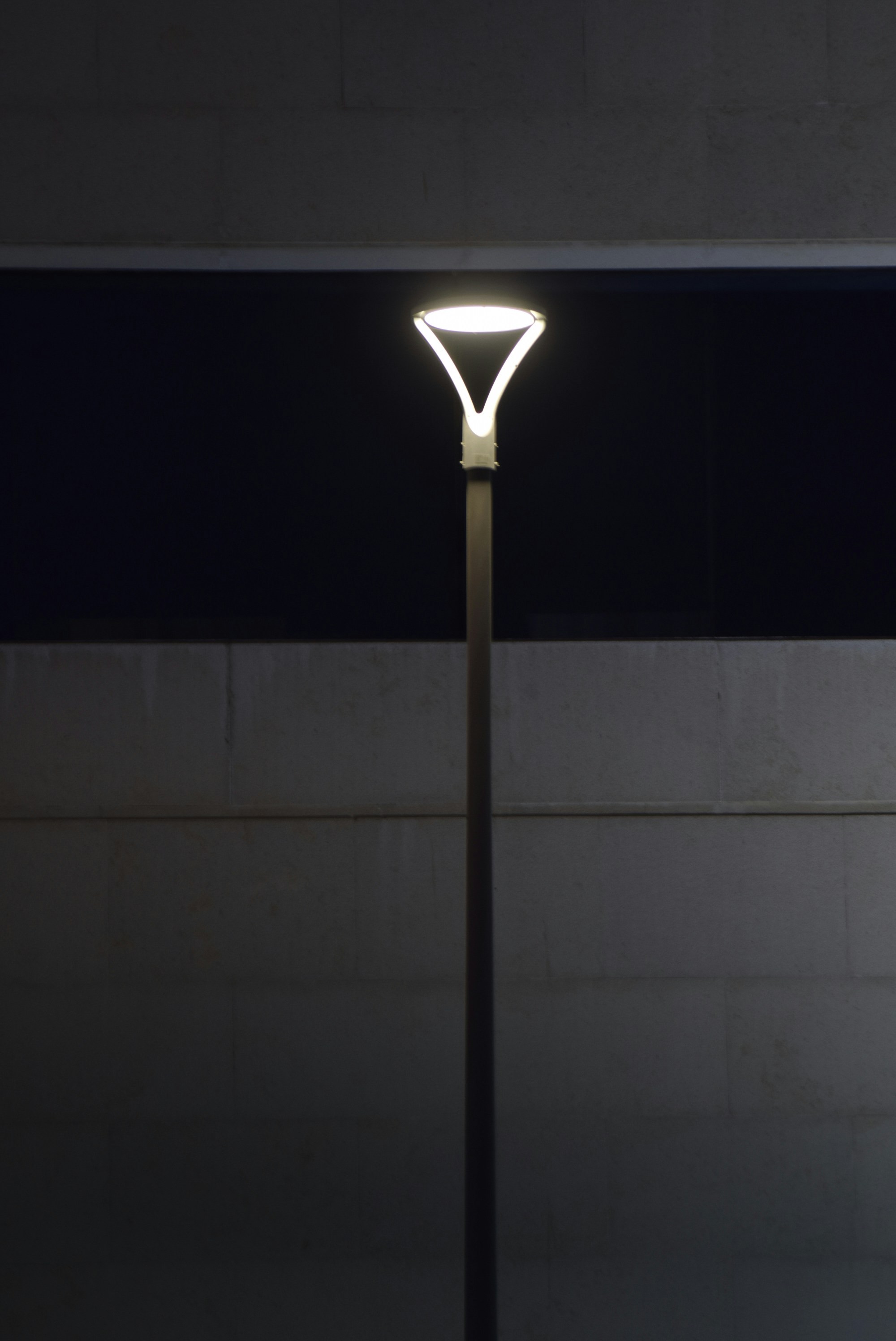 A stylish modern ceiling fan and new light fixtures in a living room.