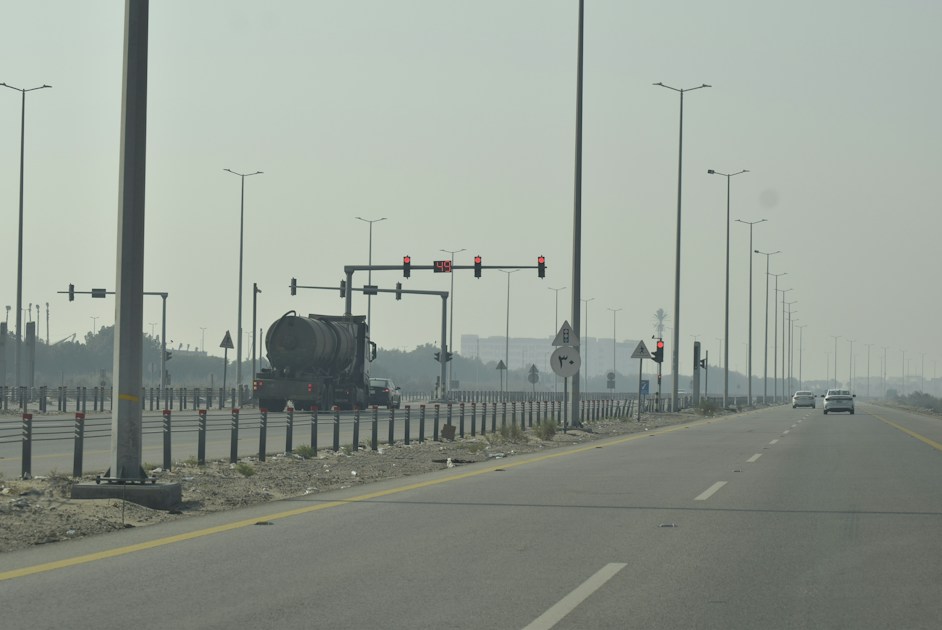 Truck on a highway with traffic lights