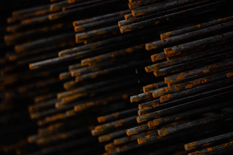 Close-up of rusty metal rods stacked together