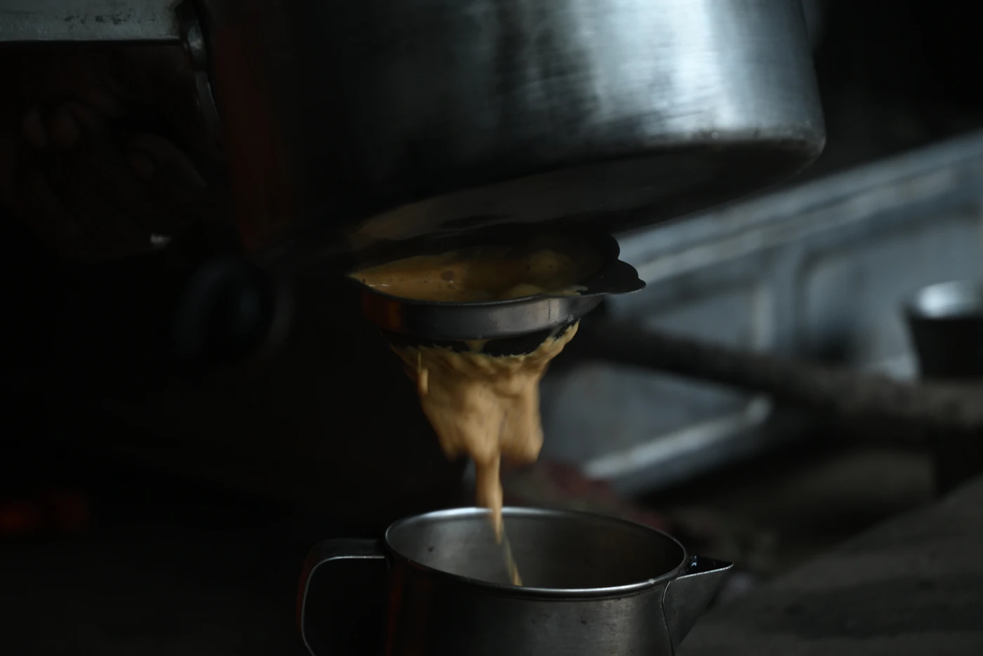 Tea being poured into a cup