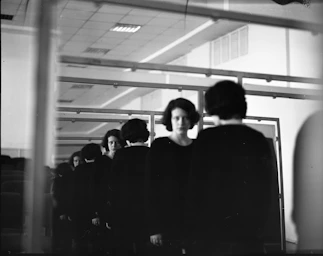 Woman's reflection in a mirror creating a line