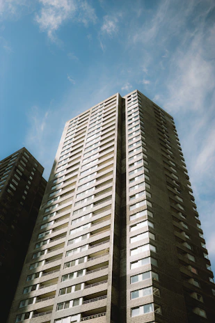 Tall apartment building against a blue sky