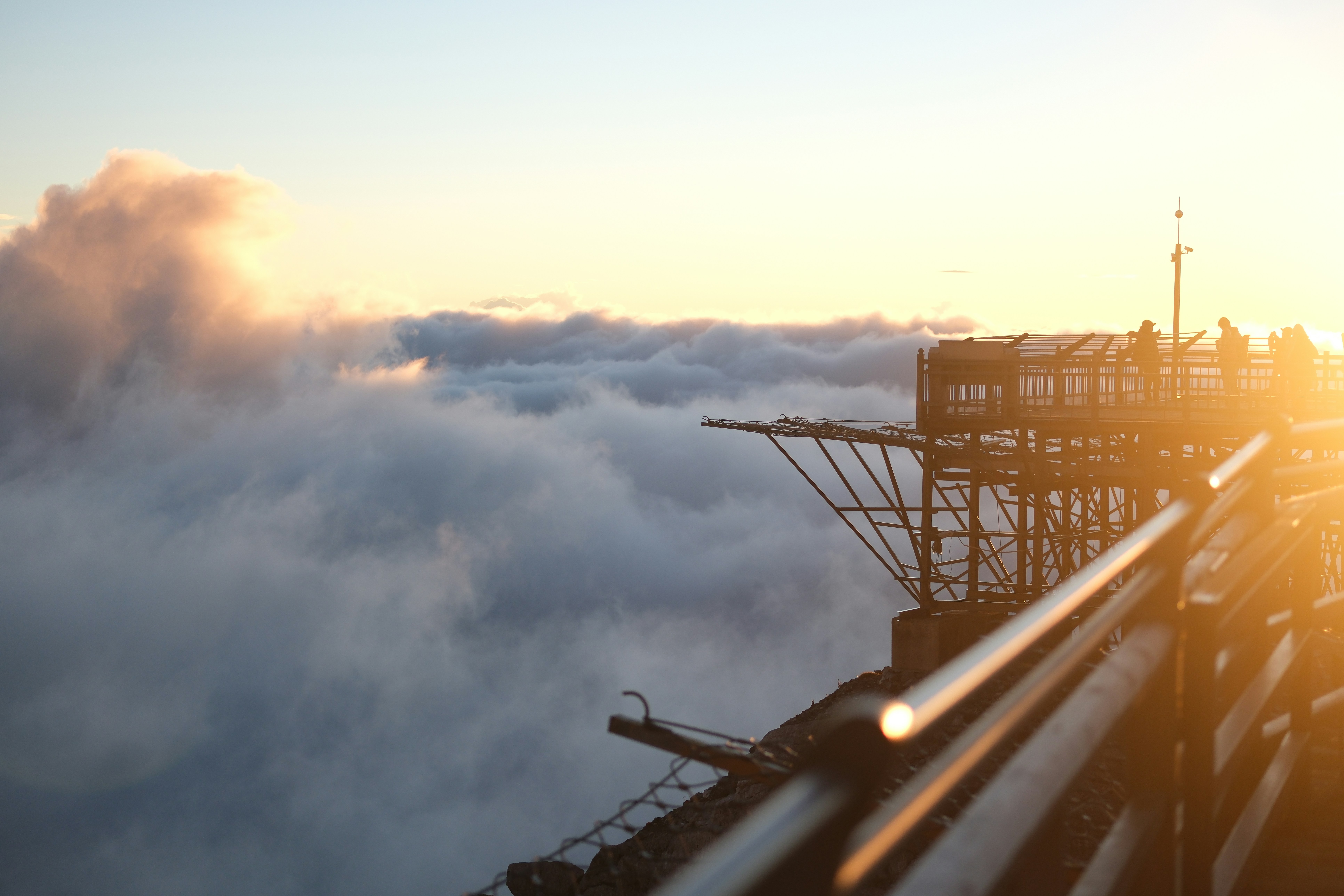 Sunrise over clouds from a high vantage point.