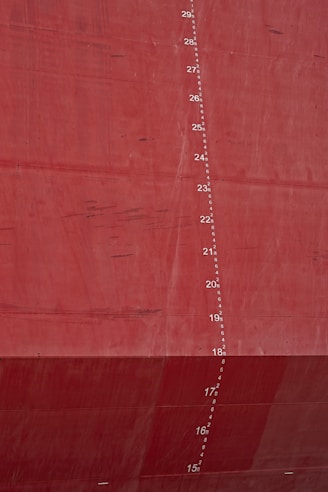 Red ship hull with draft markings