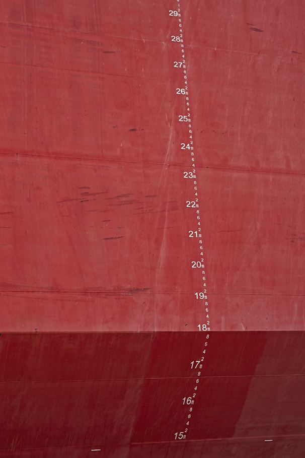 Red ship hull with draft markings