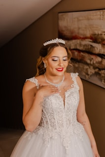 Young woman in a white formal dress and tiara