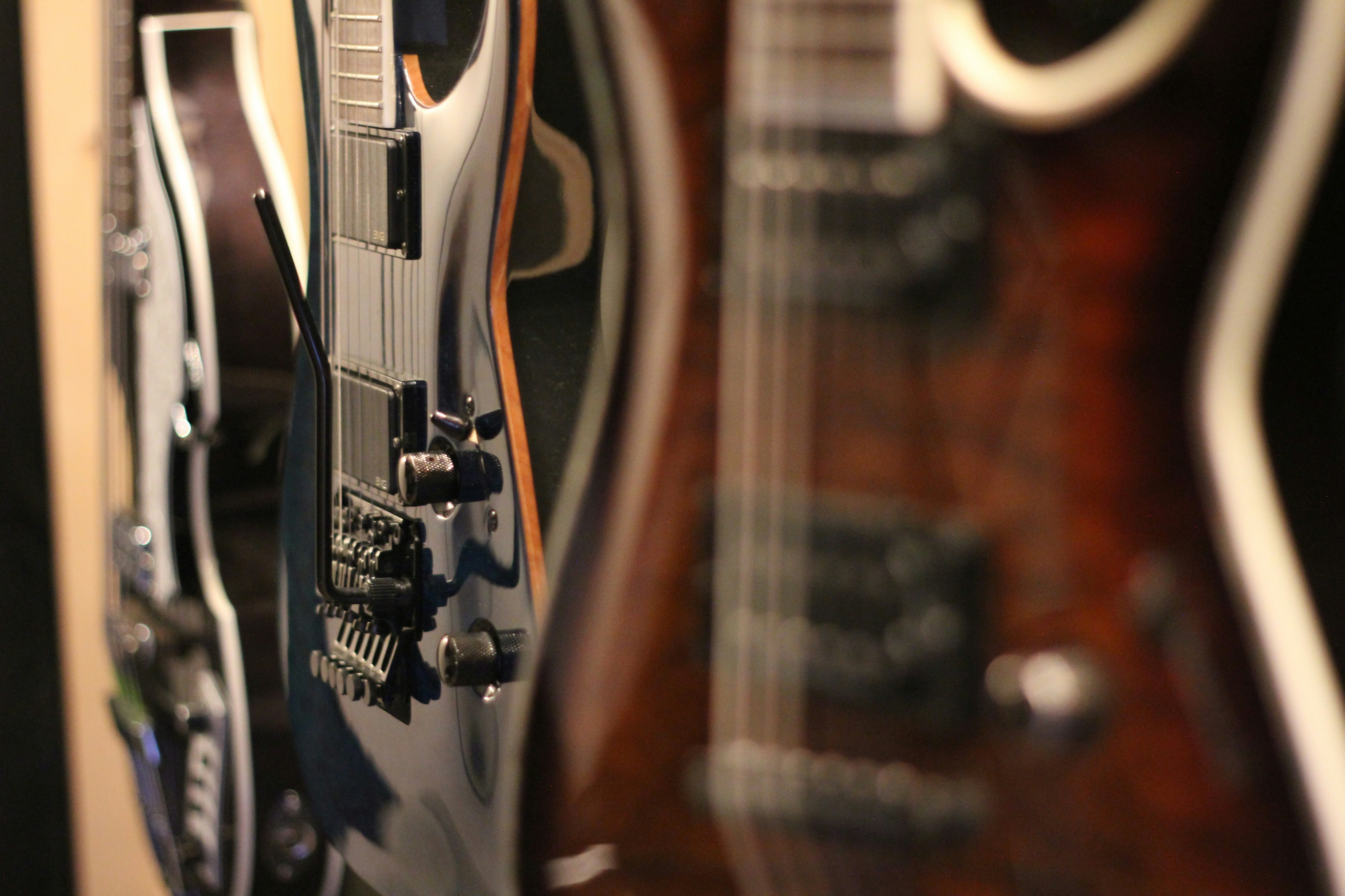 Several electric guitars lined up for sale.
