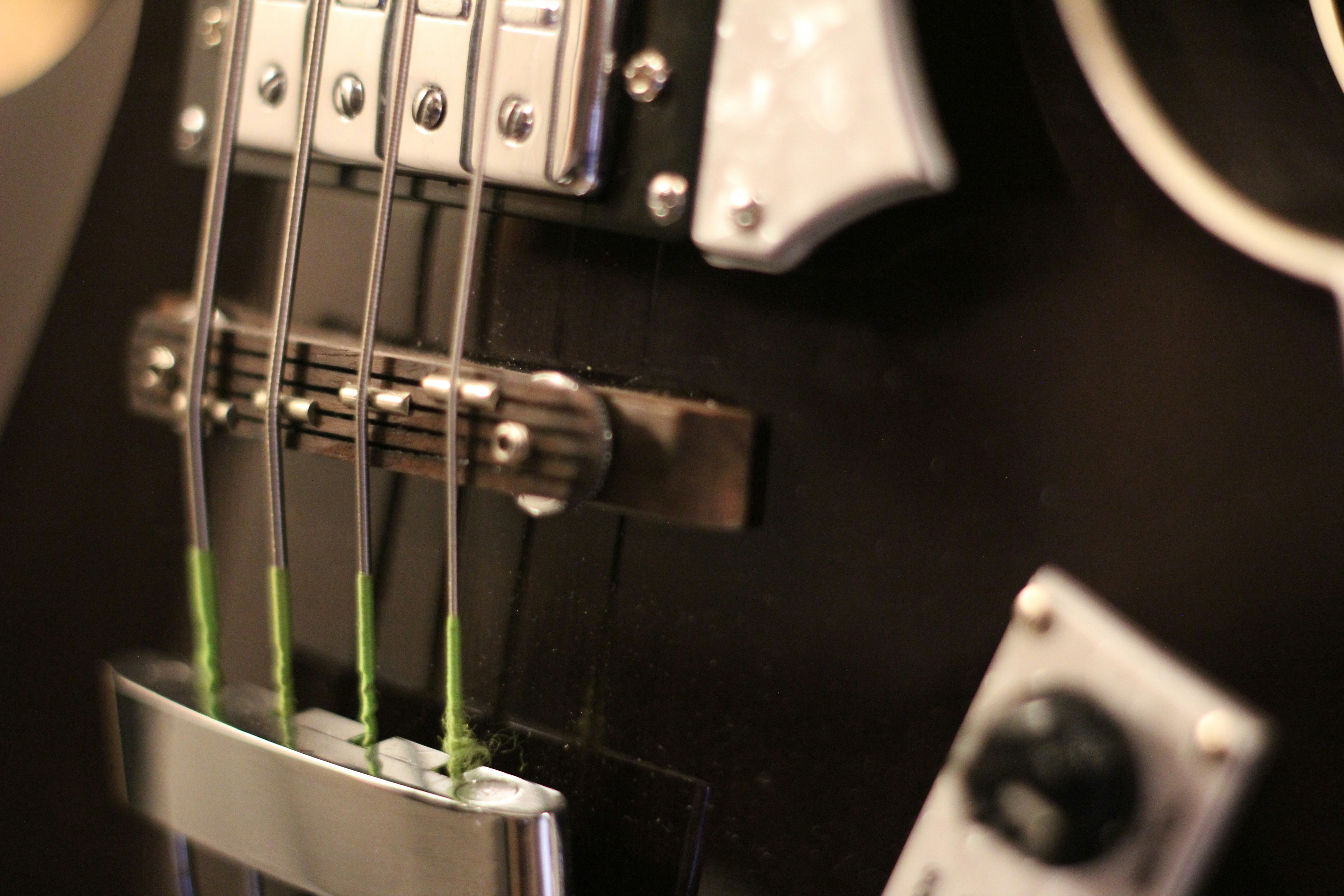 Close up of a black bass guitar strings