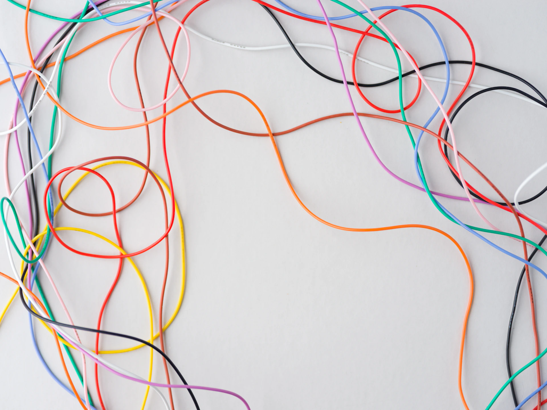 Colorful wires tangled on a white background