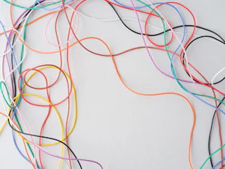 Colorful wires tangled on a white background