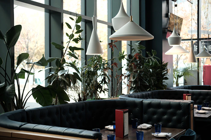 Restaurant dining area with booths and large windows