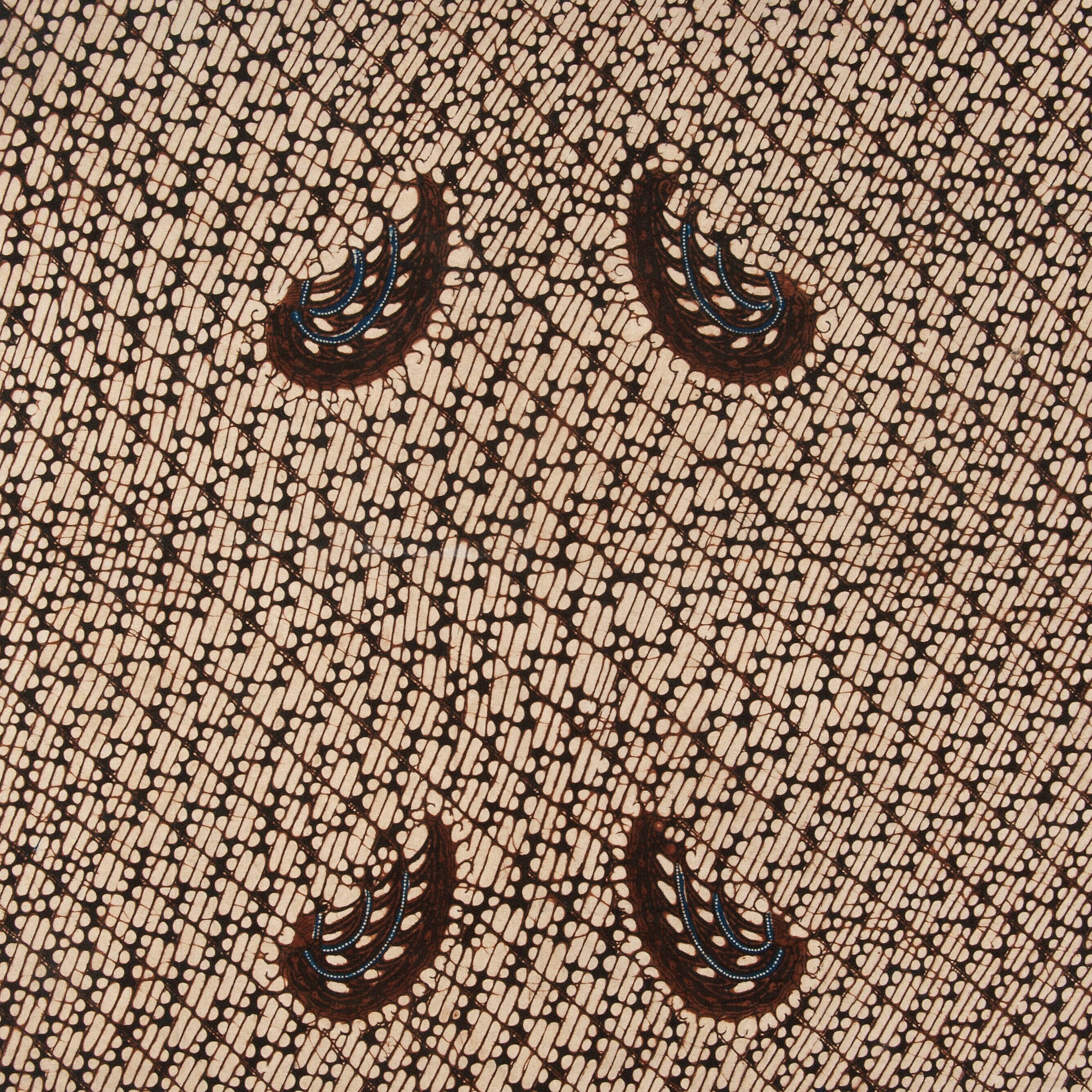 Tessuto marrone e beige con motivi paisley