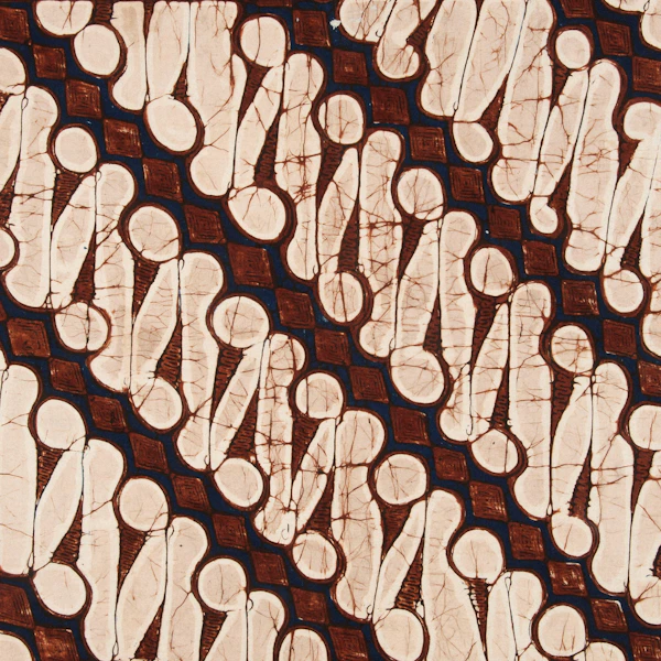 Brown and cream batik fabric with repeating traditional pattern
