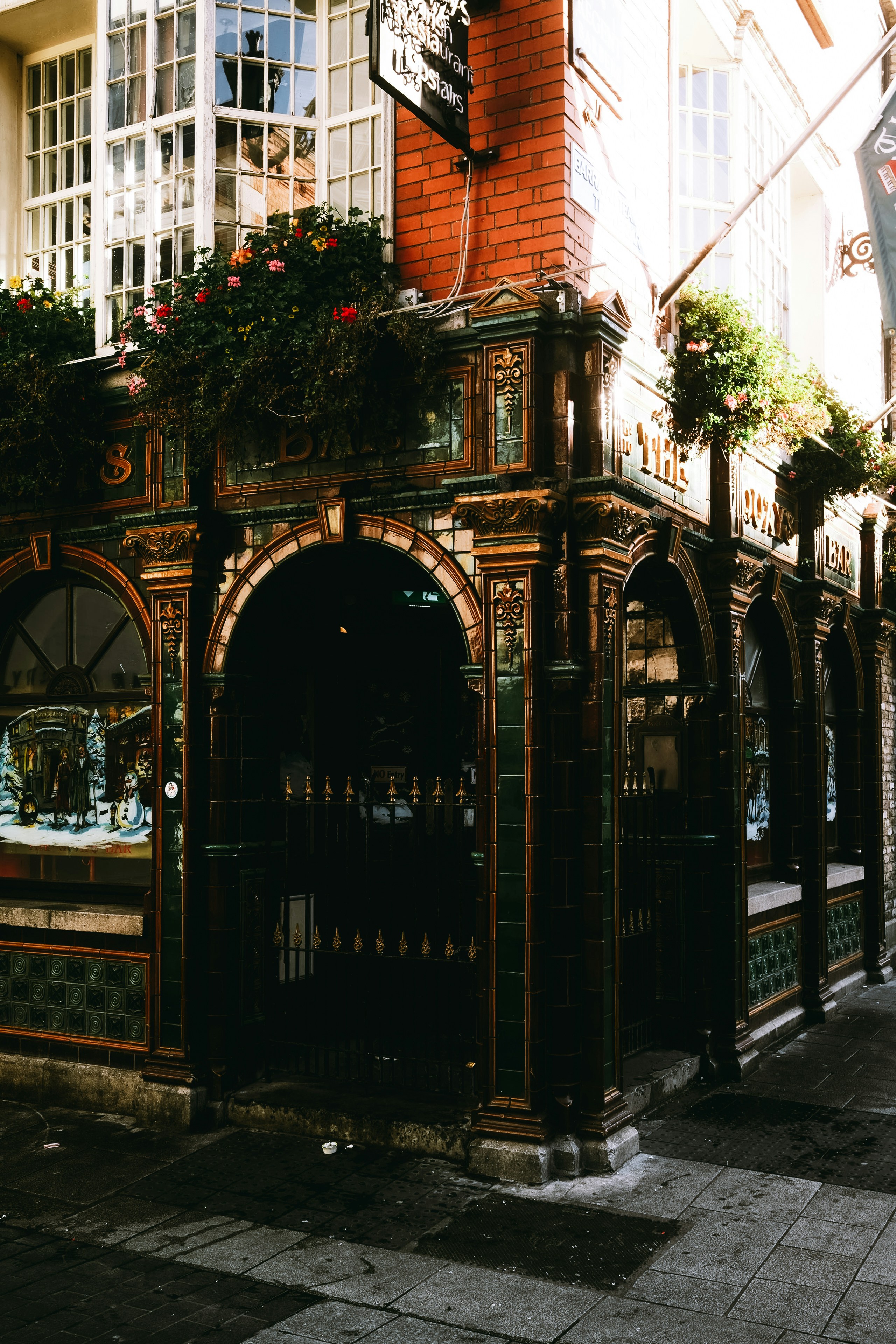 Ornate victorian pub exterior with arched windows