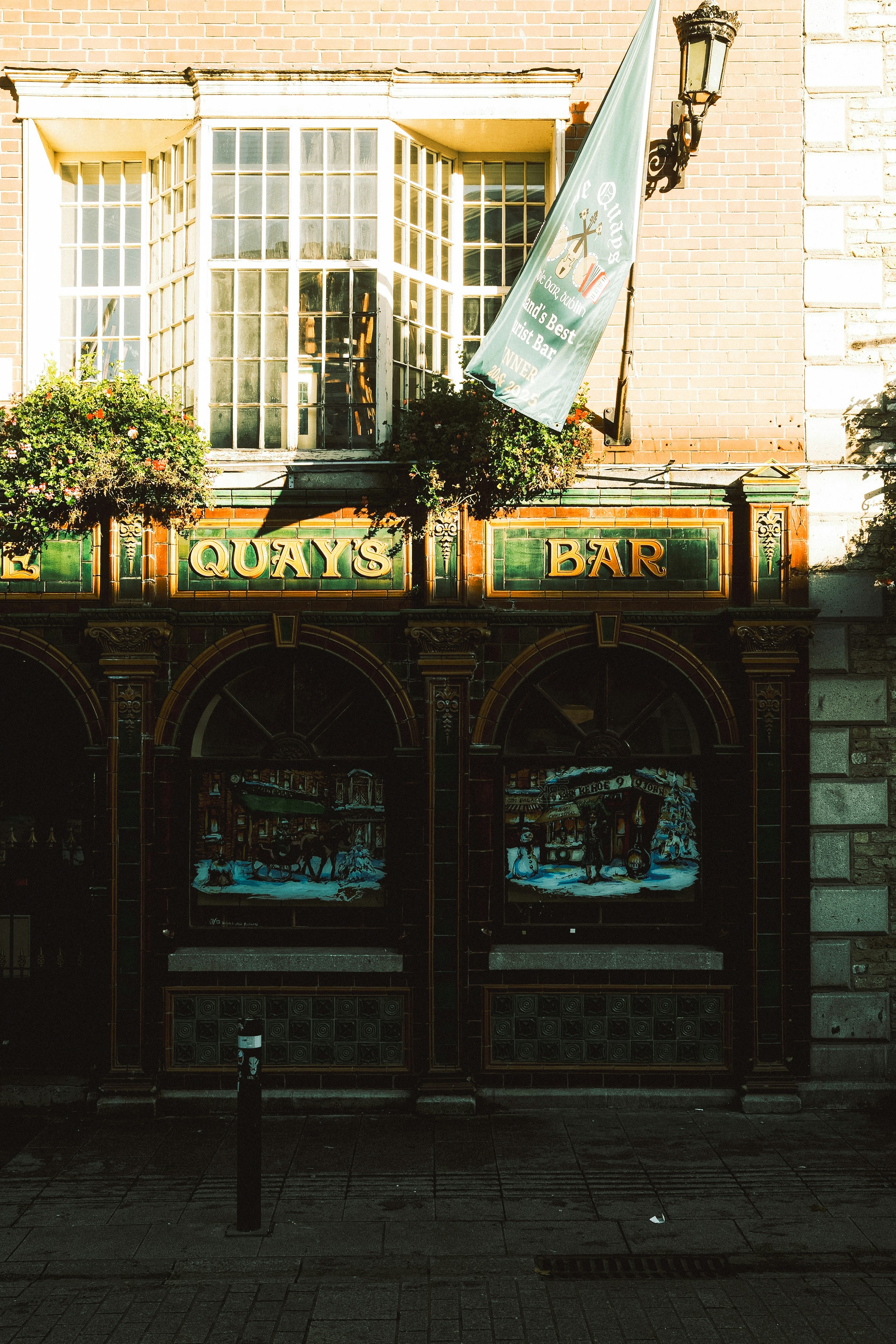 Quays bar with ornate facade and flag