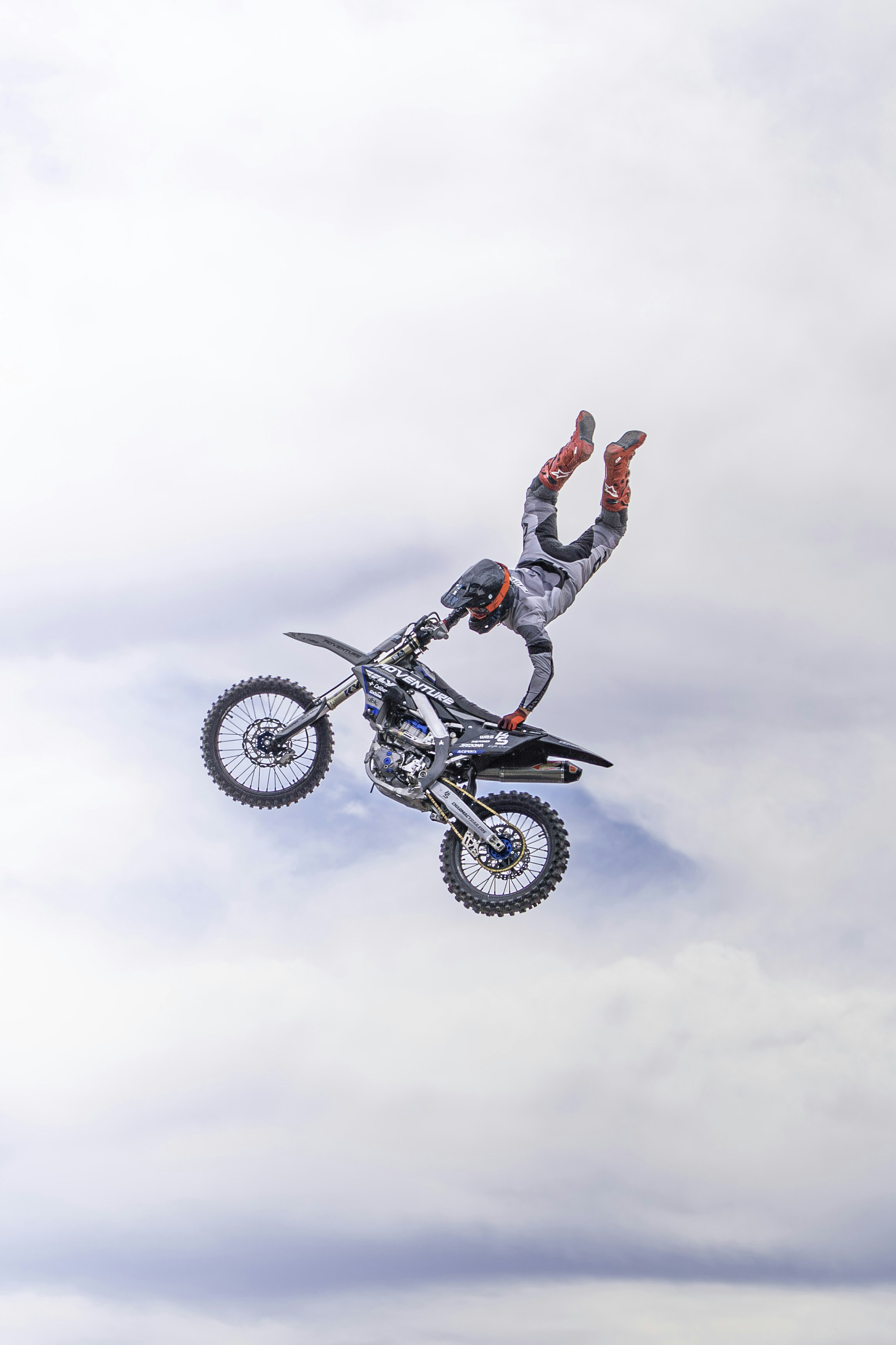 Motocross rider performing a trick mid-air