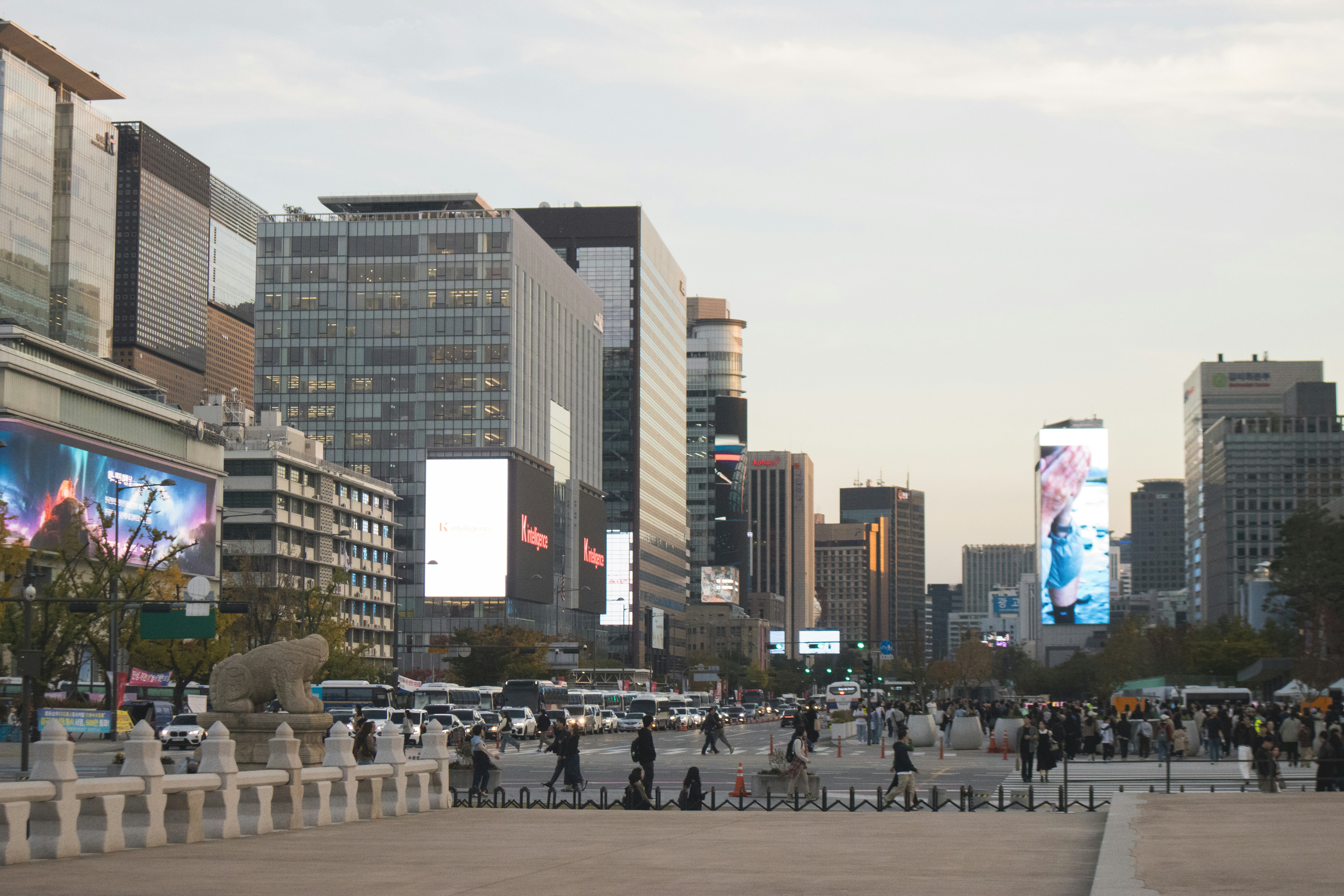 City street with tall buildings and digital billboards