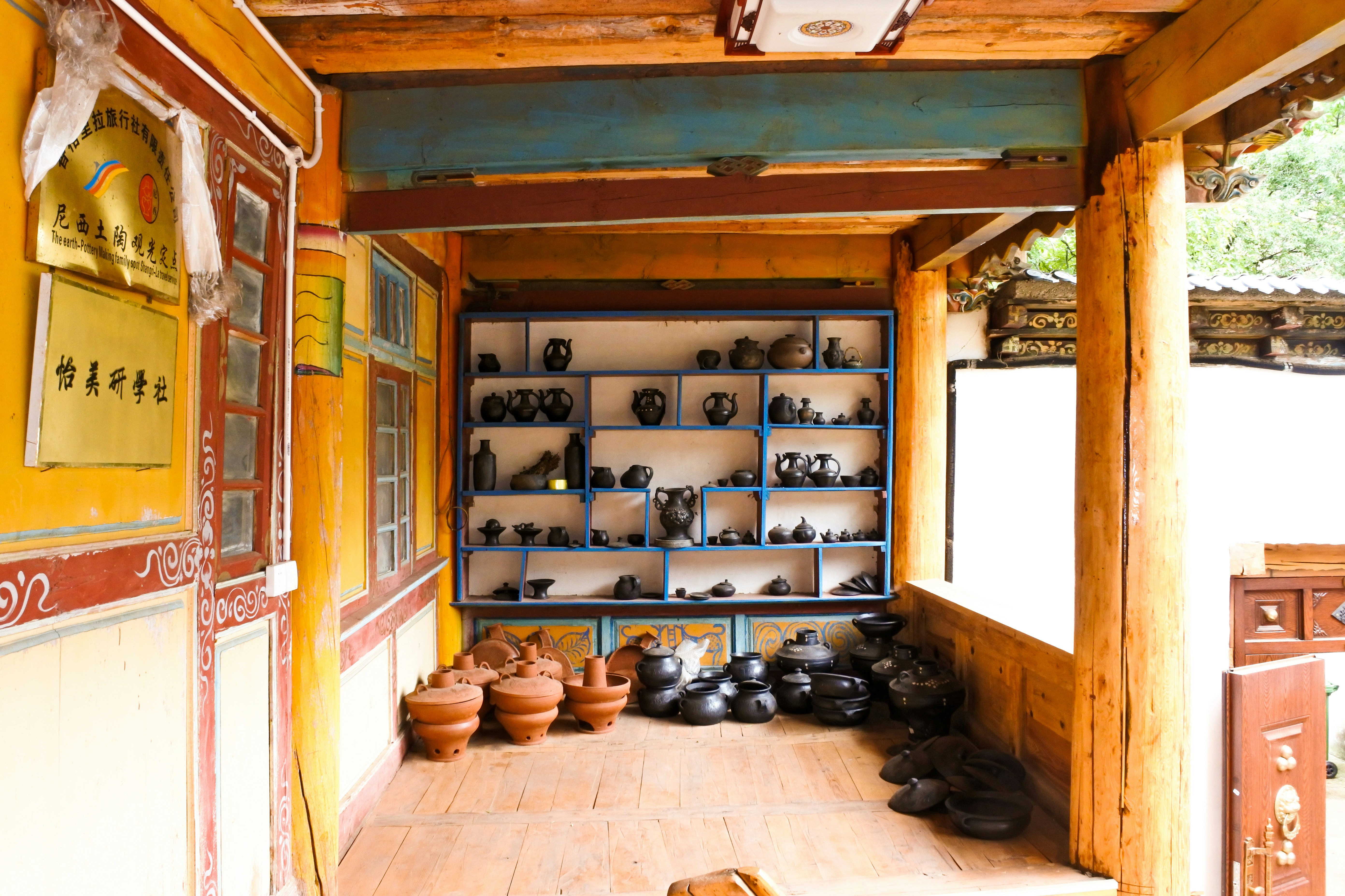 Shelves filled with pottery and clay pots