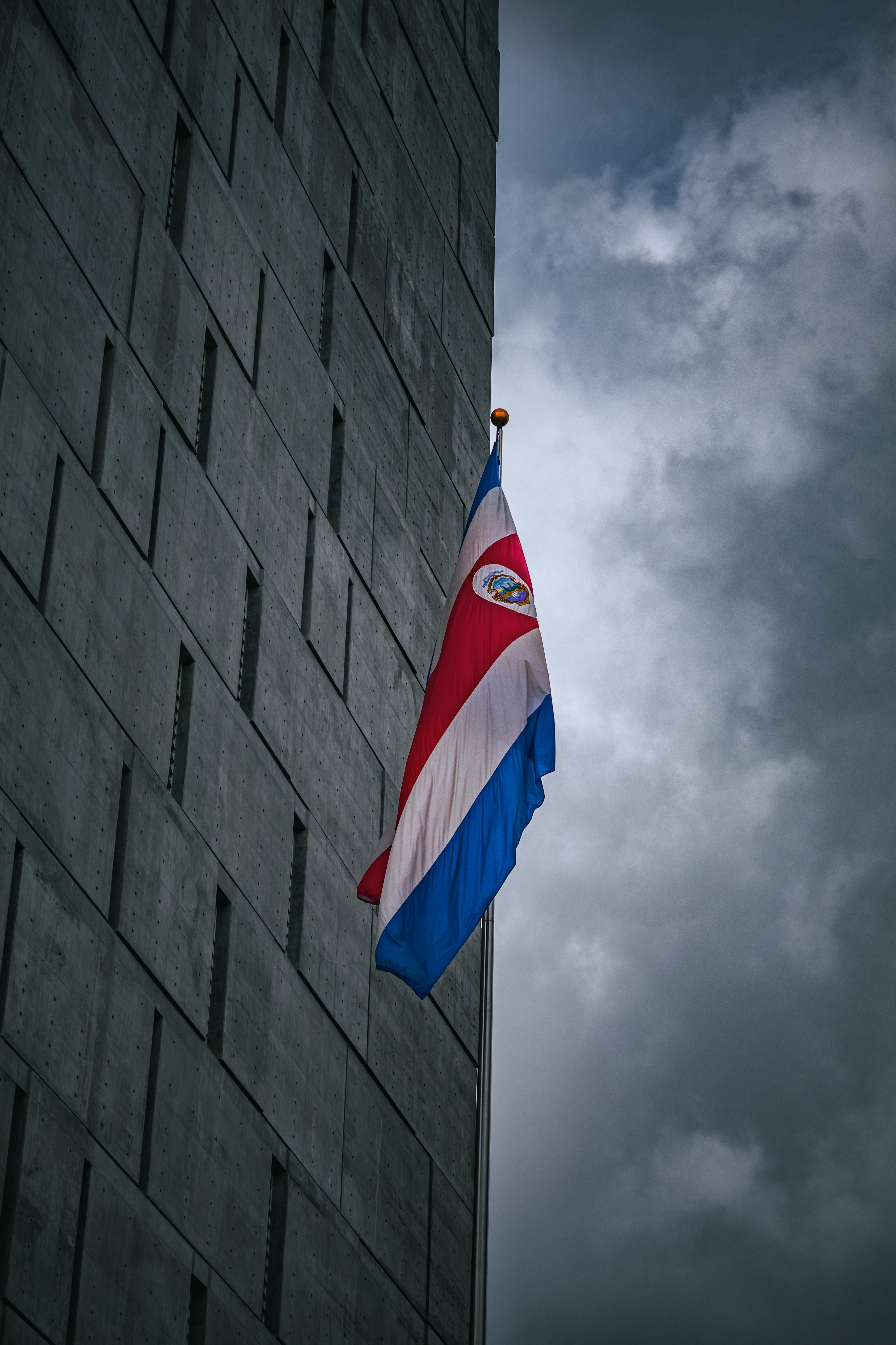 Costa rican flag hangs on a modern building