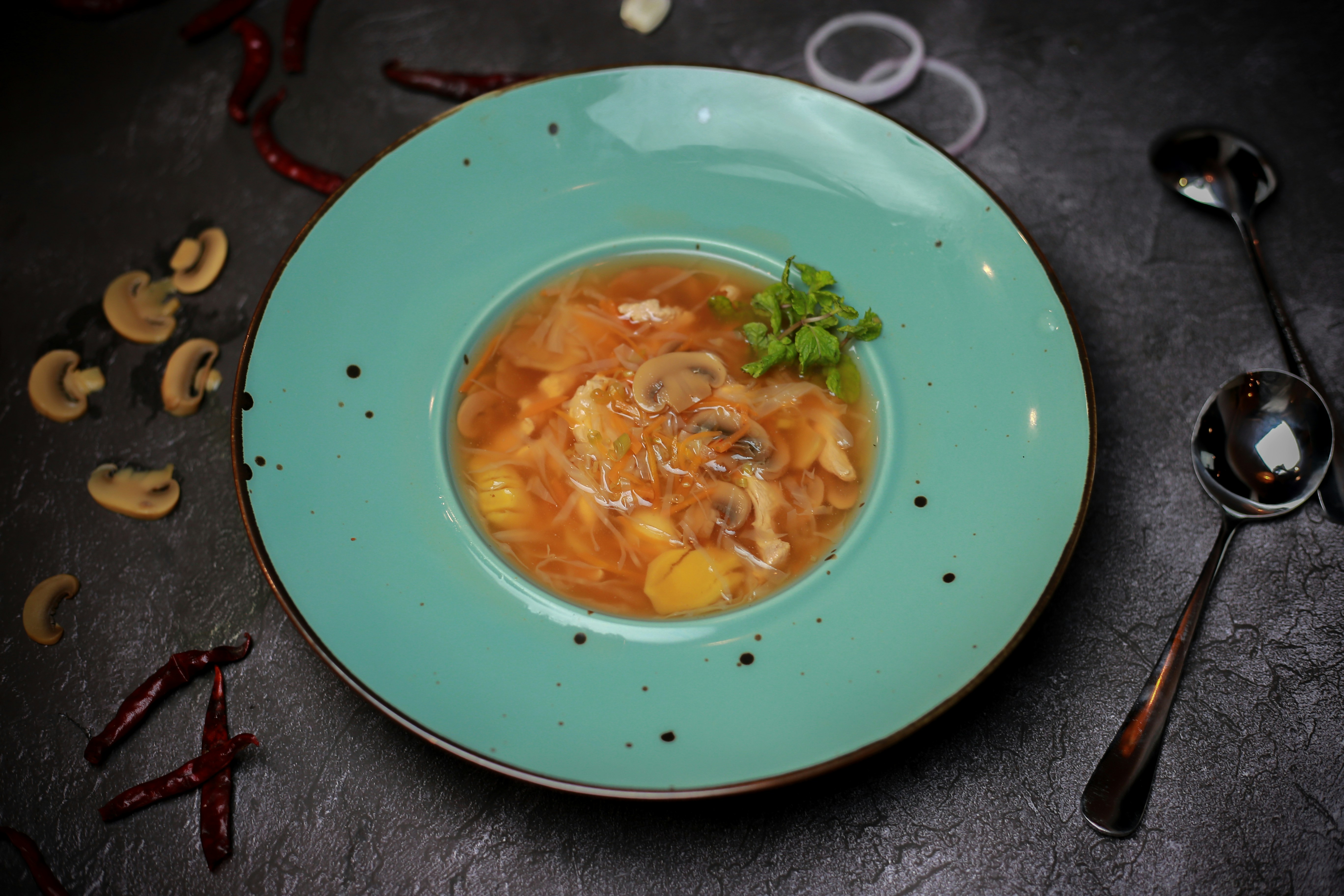 Clear broth soup with mushrooms