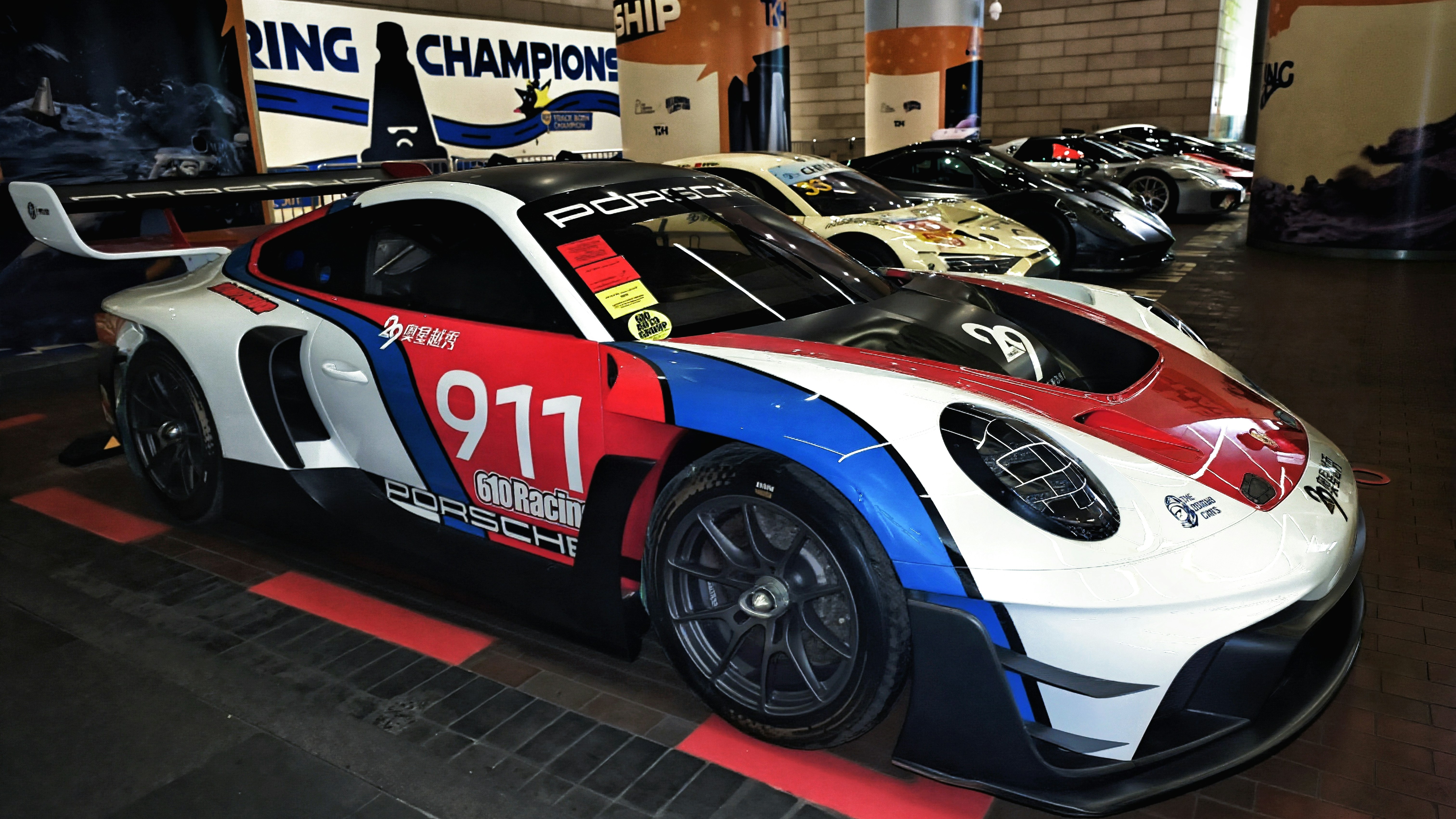 Race car with "911" and "porsche" logos