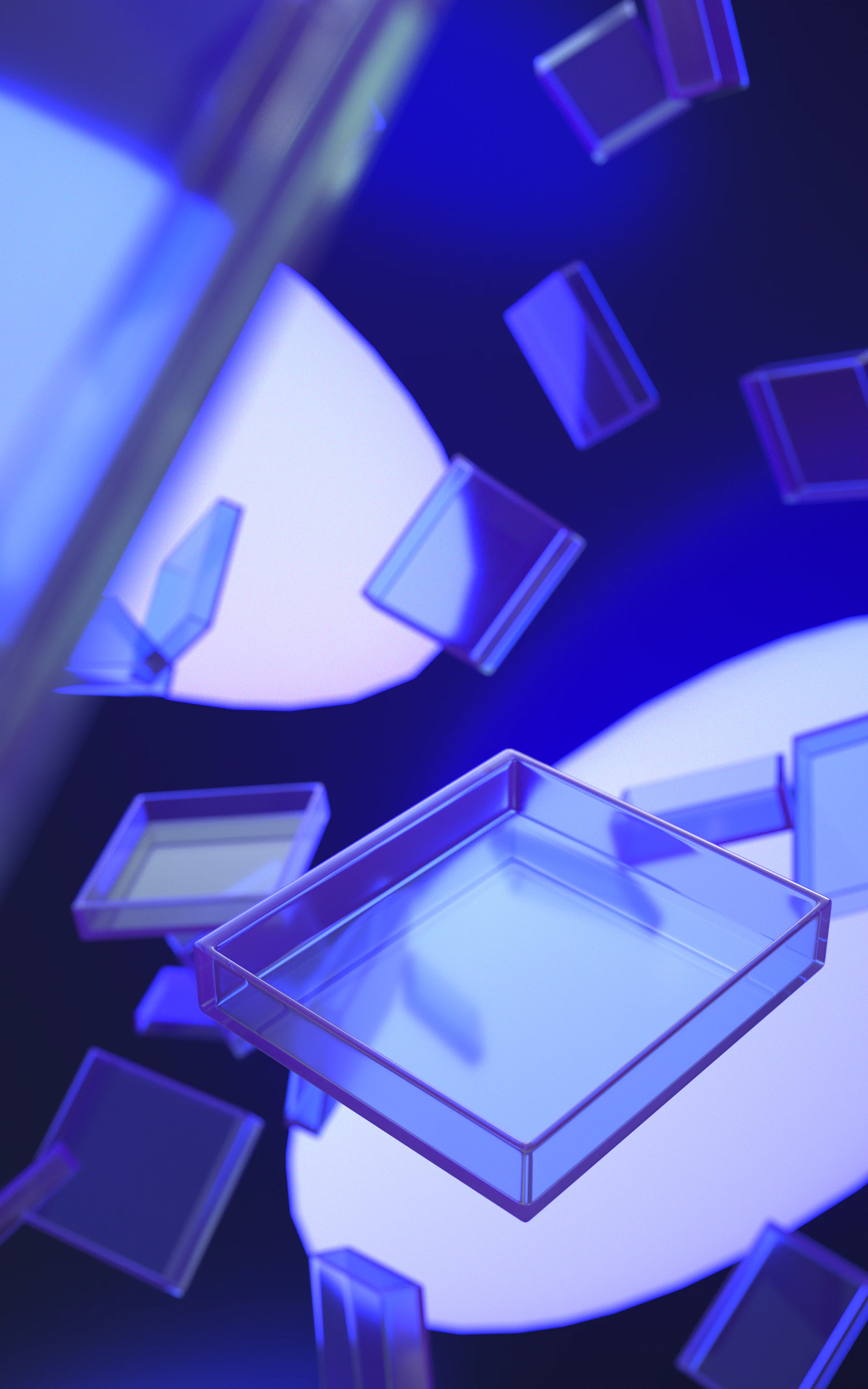 Clear square containers floating in blue light