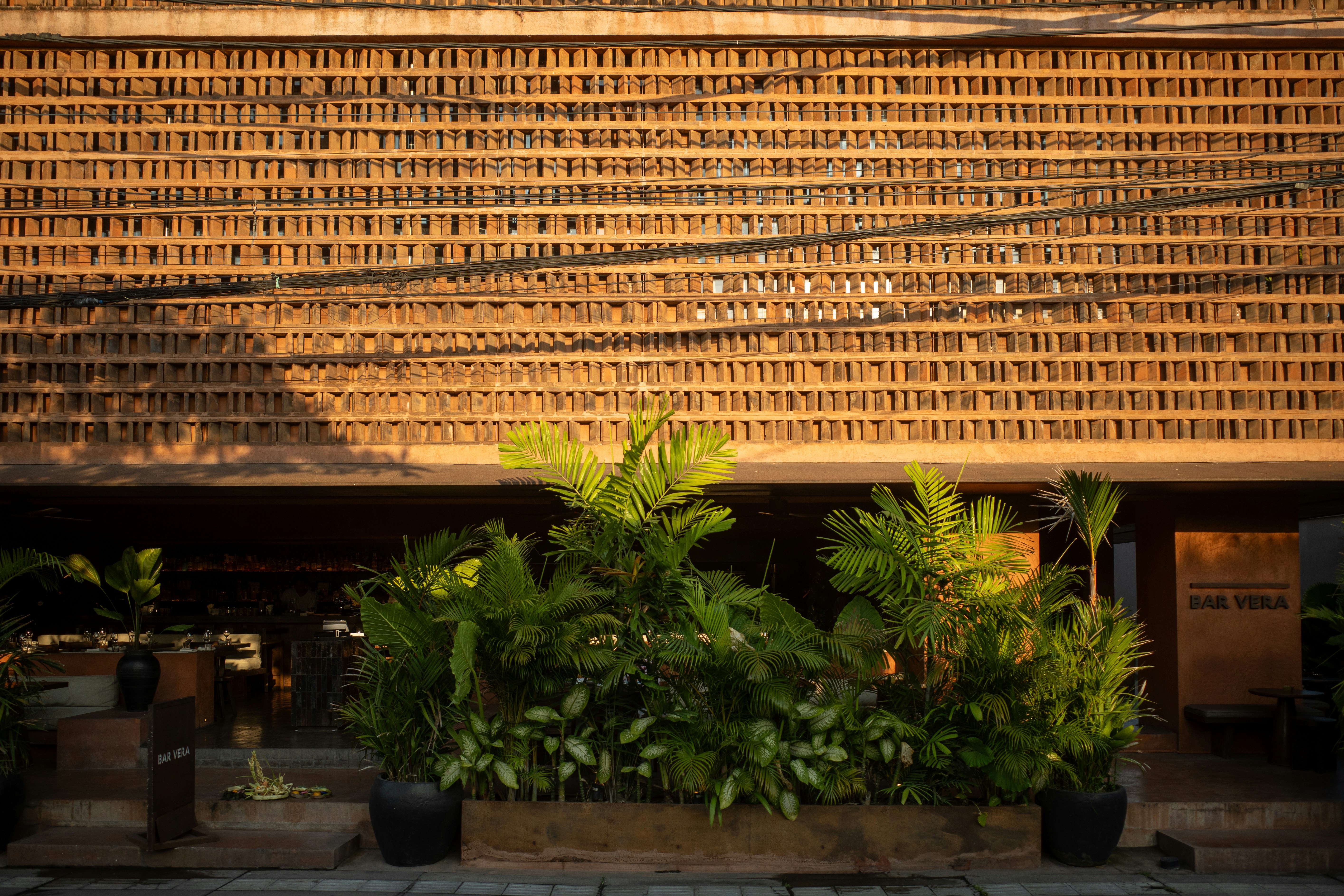 Warm terracotta interior with bamboo wall