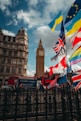 Big ben tower with flags flying in front