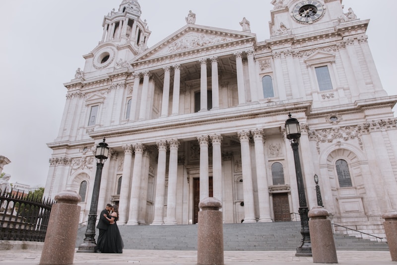 glamorous couple posing at grand cathedral