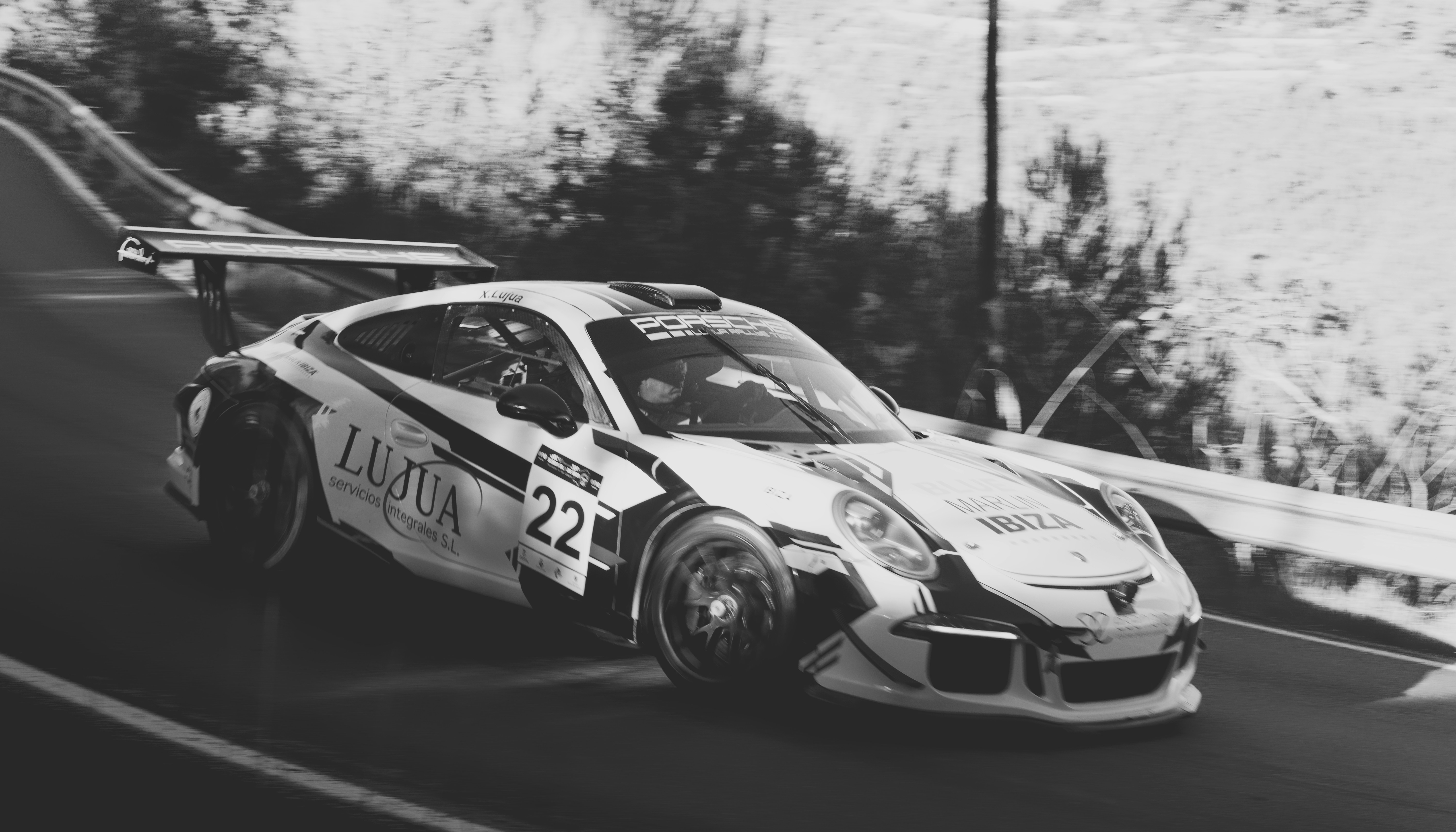 Race car speeding down a winding road.