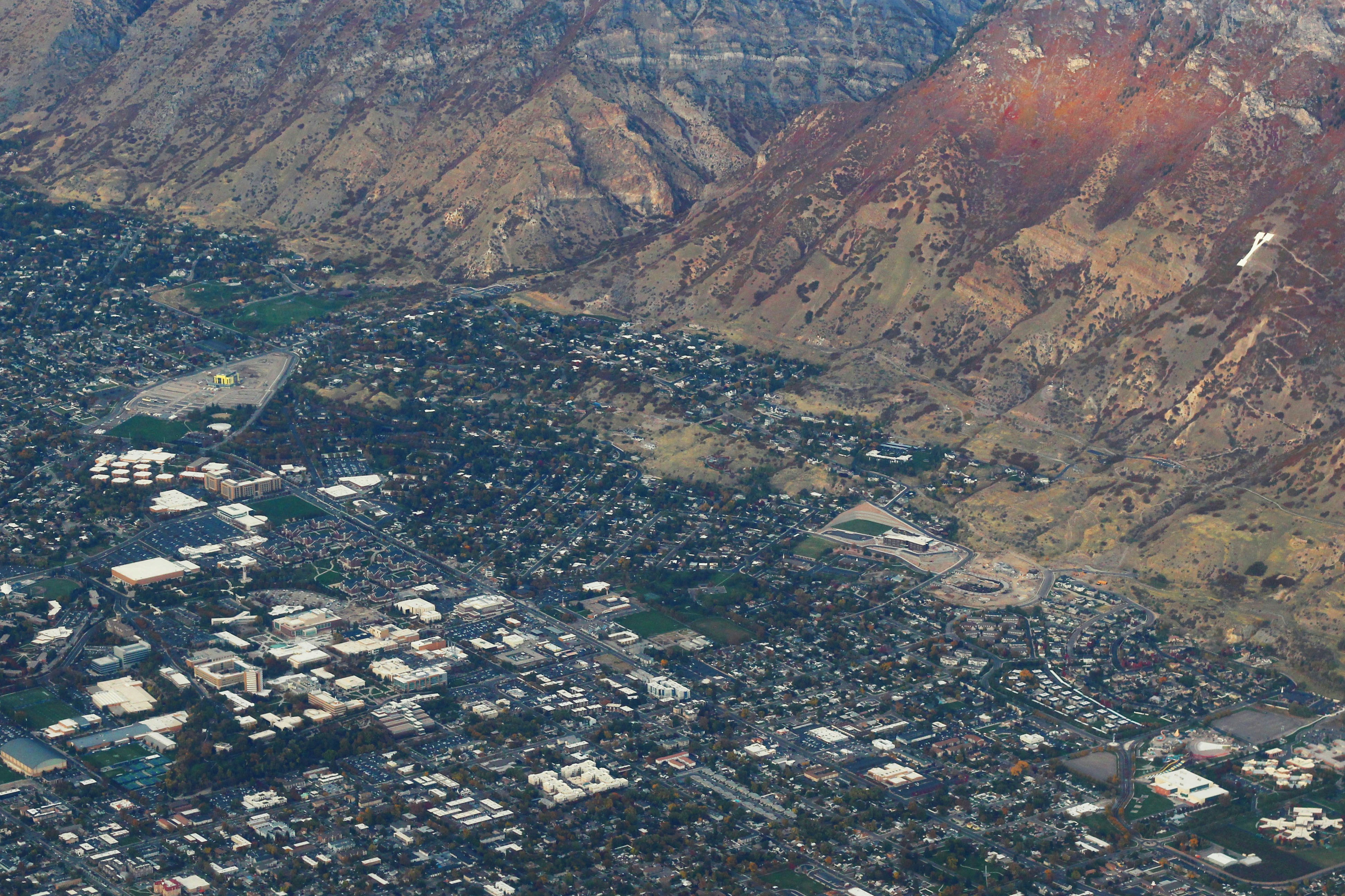 Aerial view of a city nestled against mountains