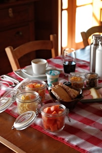 Breakfast spread with fruit, yogurt, and bread.