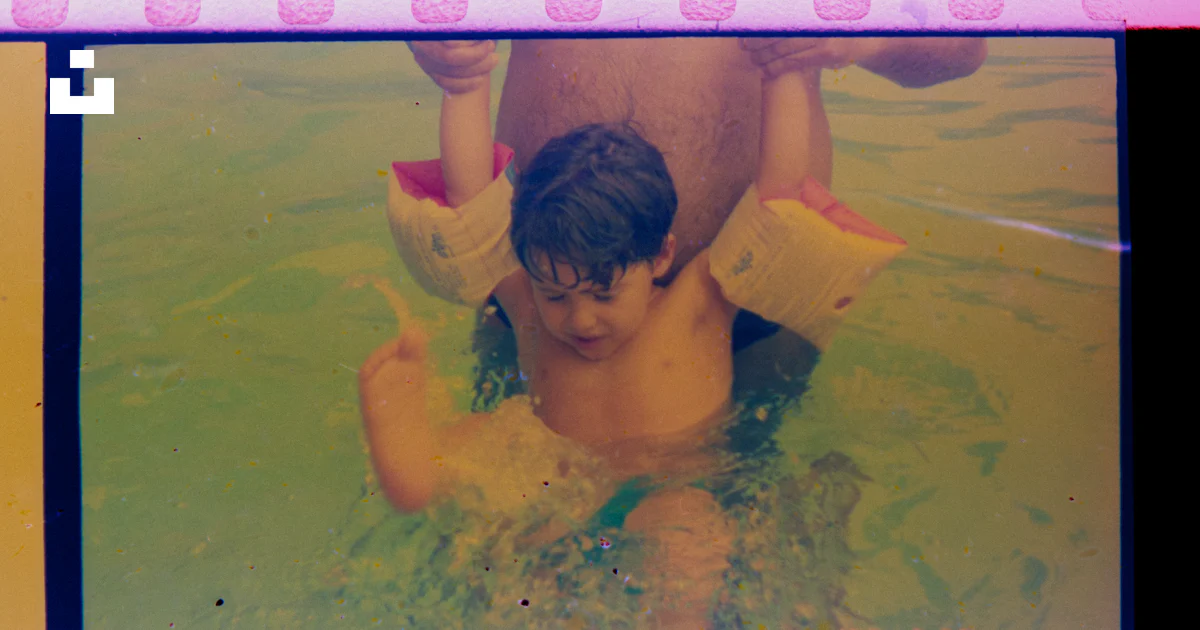 Floaties In Water Child with arm floaties in shallow water photo – Free Parenting Image ...