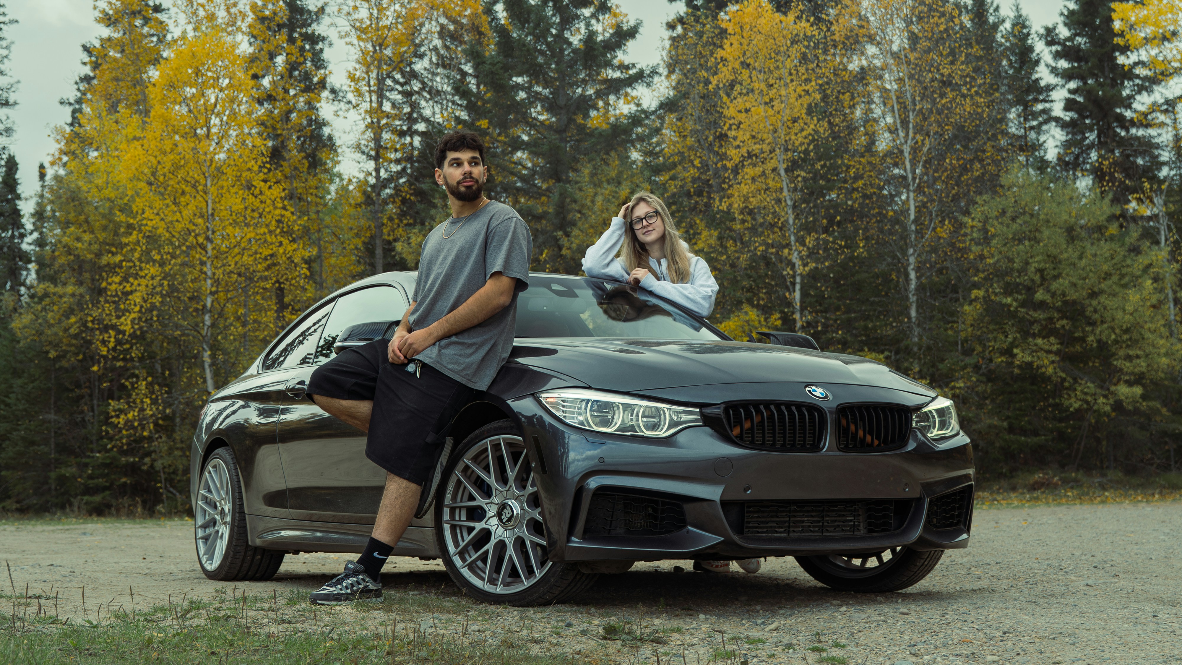 Couple with luxury car