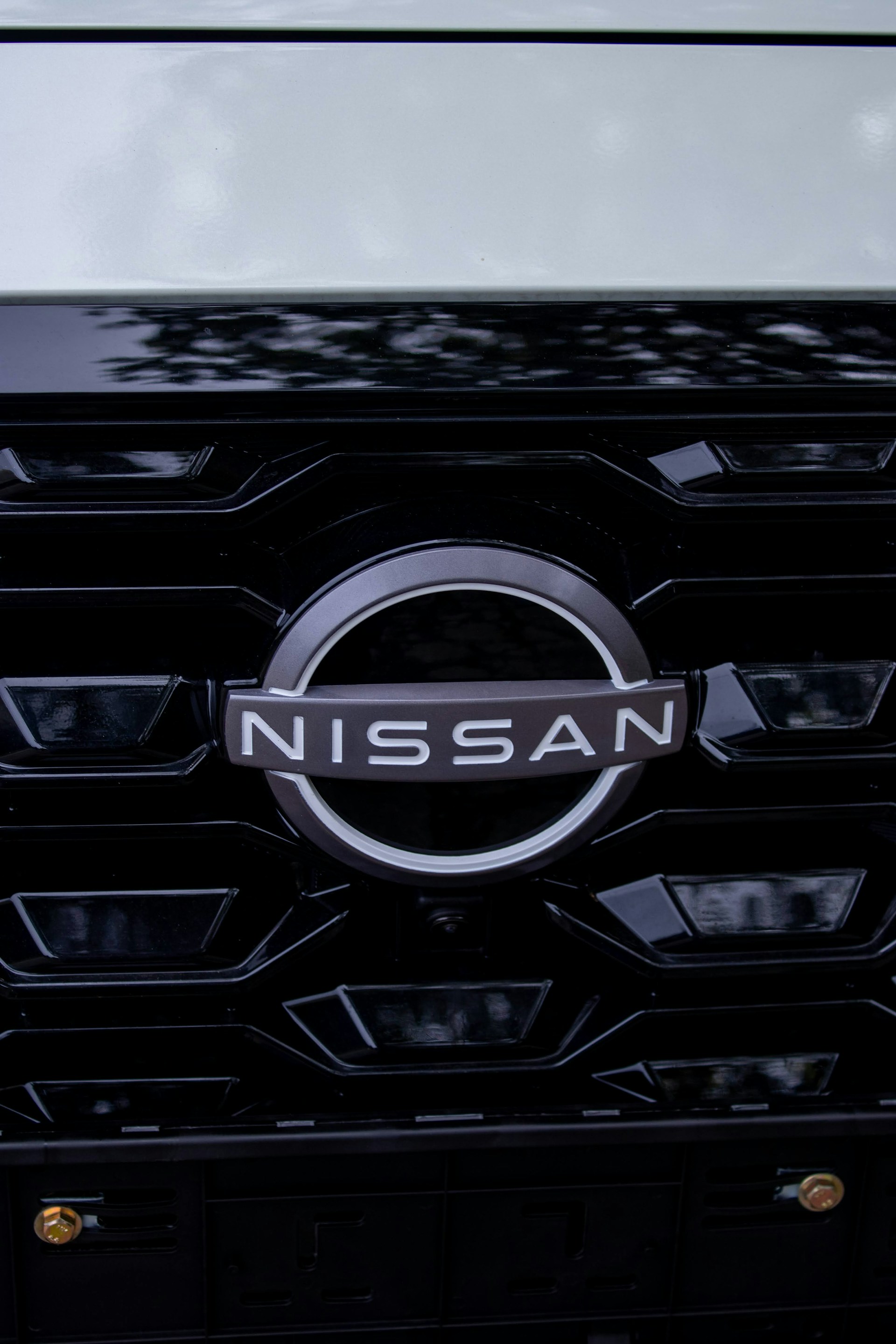 Nissan logo on a black grille