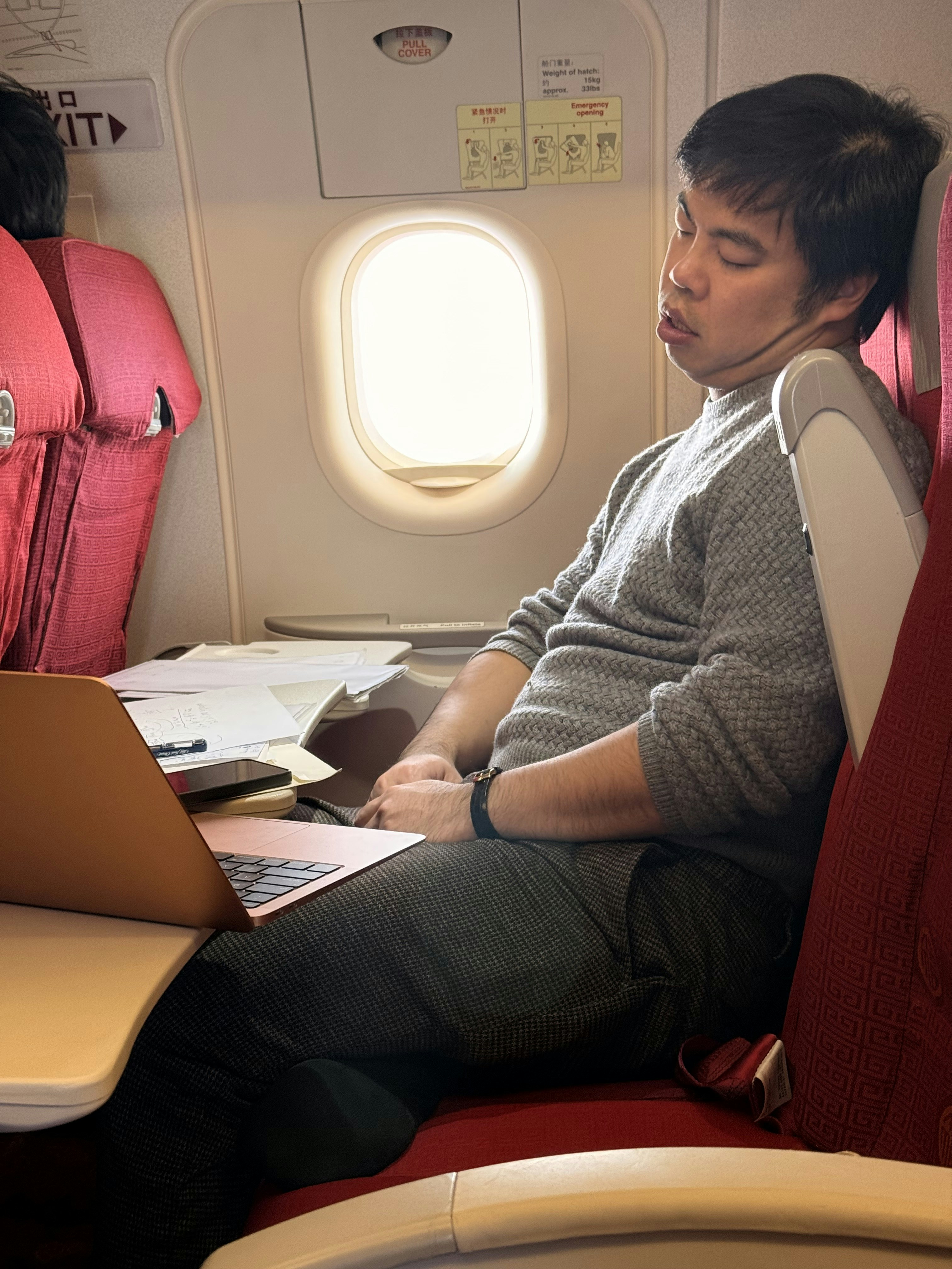 Passenger resting on airplane seat