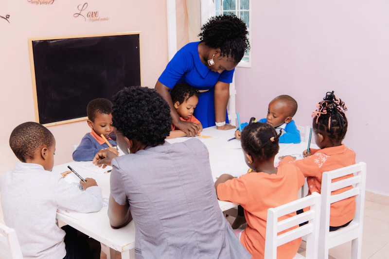 Caring teacher with young students