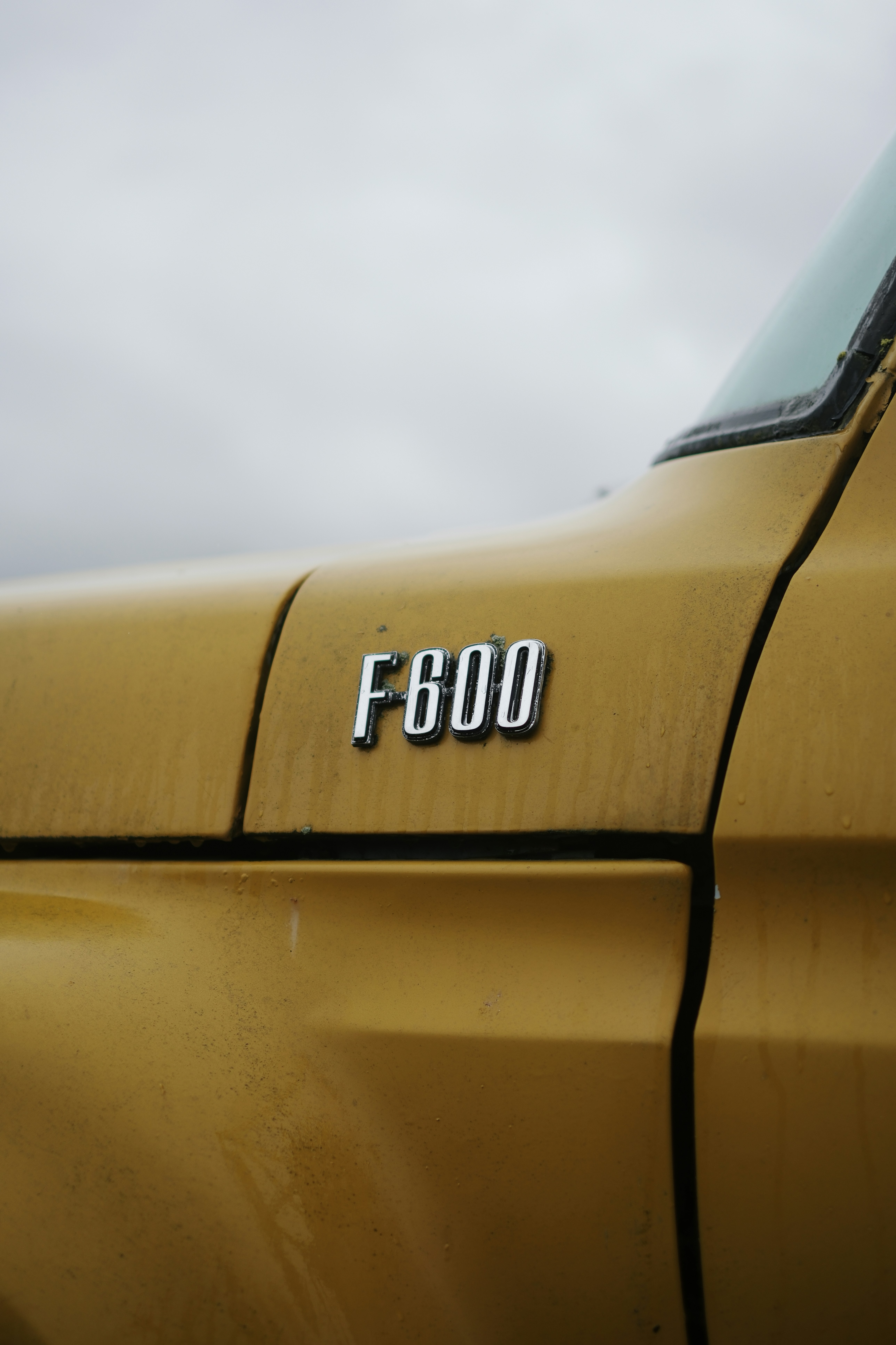 Yellow truck fender with f600 emblem