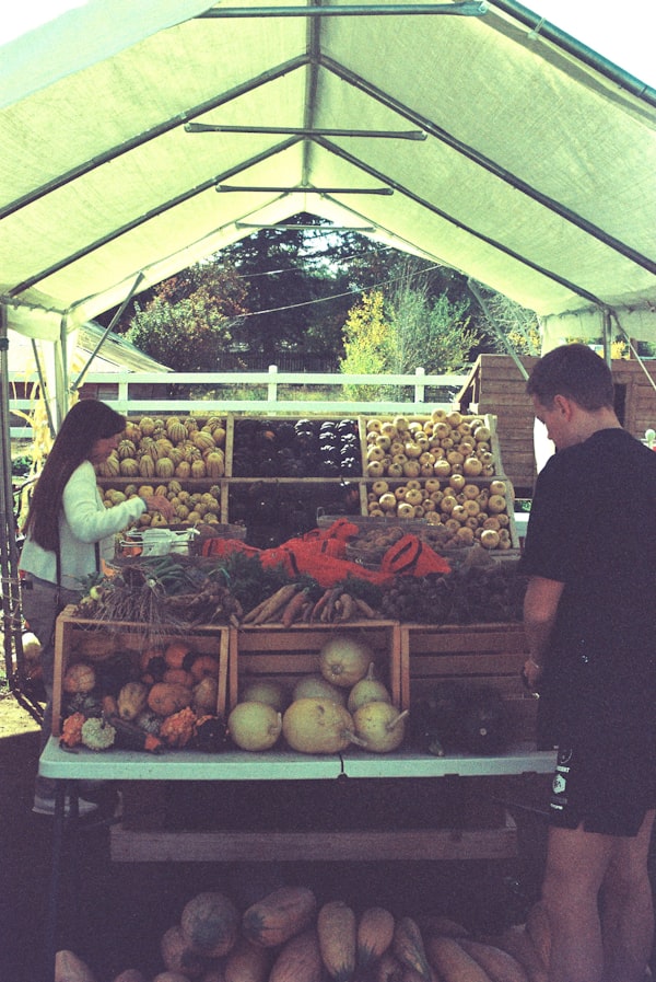 Shoppers browsing fresh produce at the farmers market