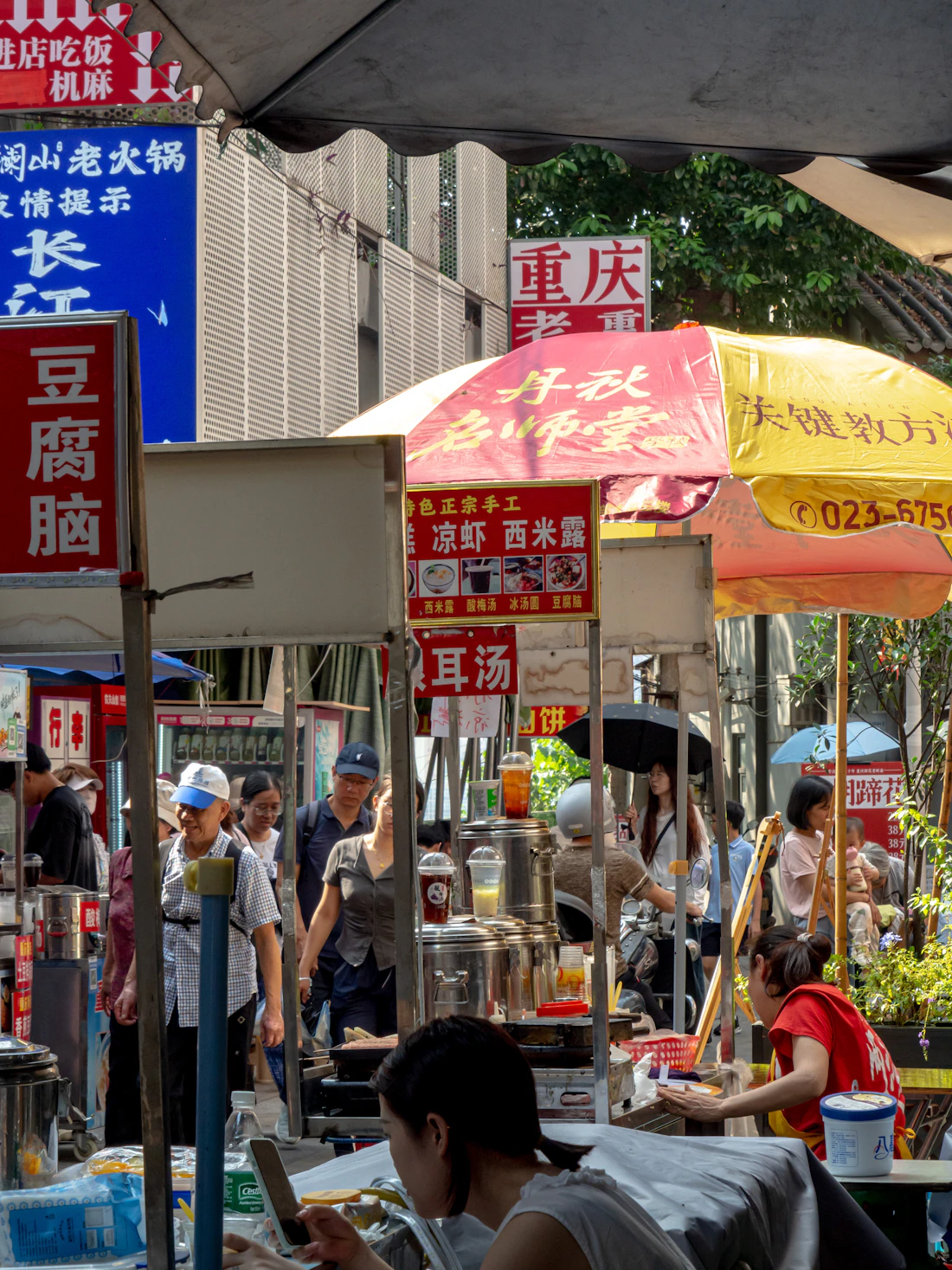 Bustling Thai street-food stalls with glowing signs at a night market
