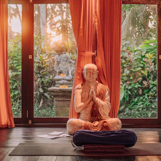 Buddhist statue meditating in a tranquil room