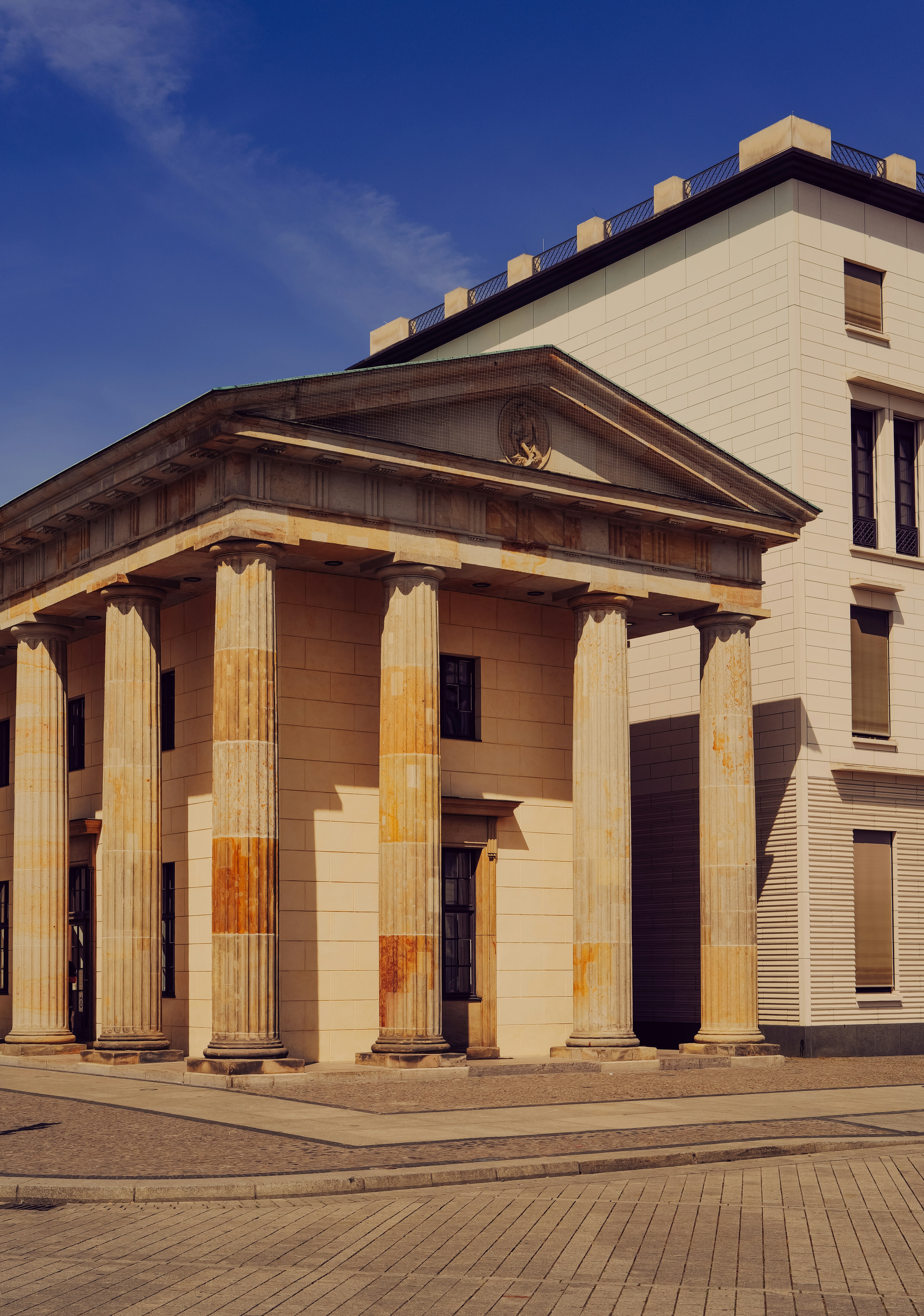 Classical building with large columns and blue sky