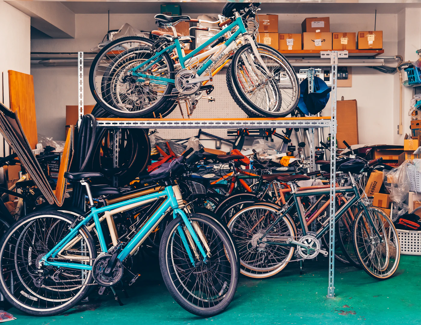 Bicycles stored on wall shelves in a garage