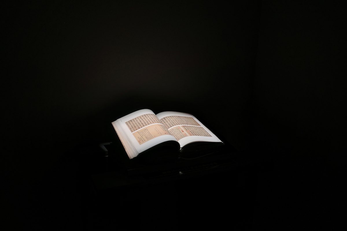 Open Bible glowing in the dark, a verse of comfort for night shift workers