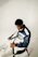 Man wearing a blue and white racing jacket.