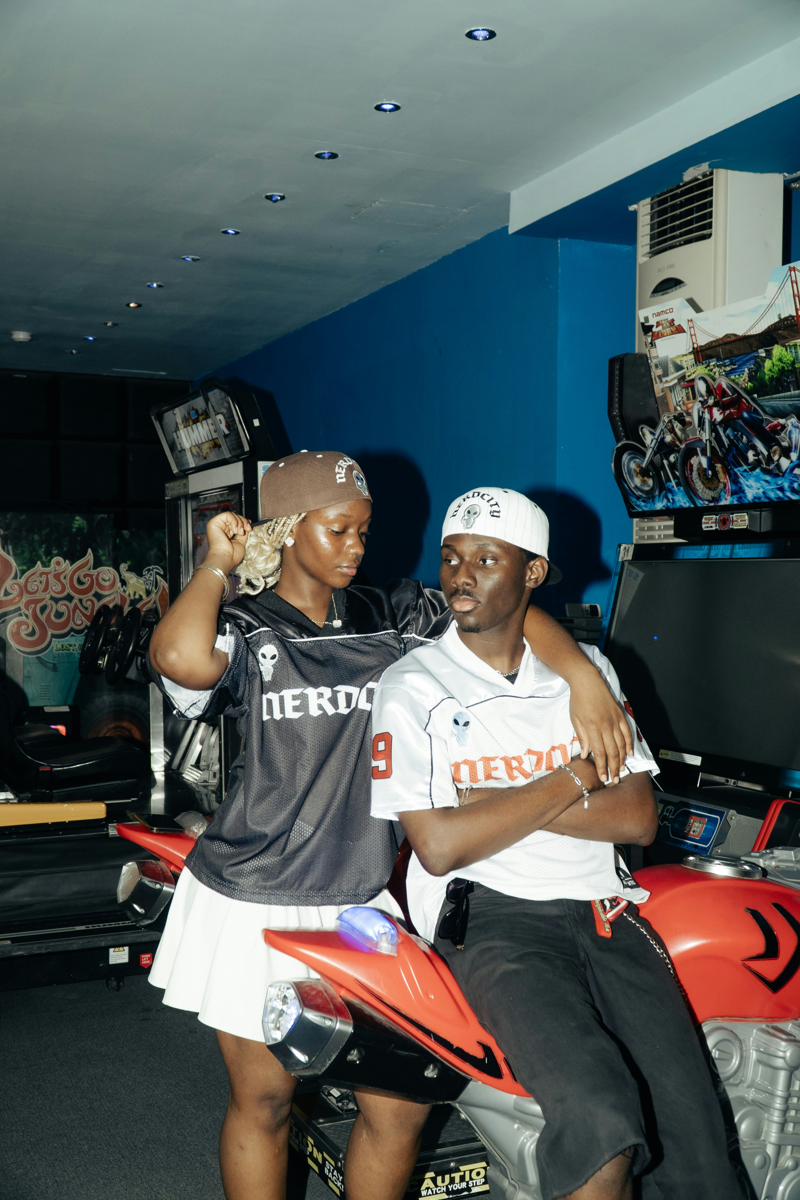 Young couple in arcade with vintage games