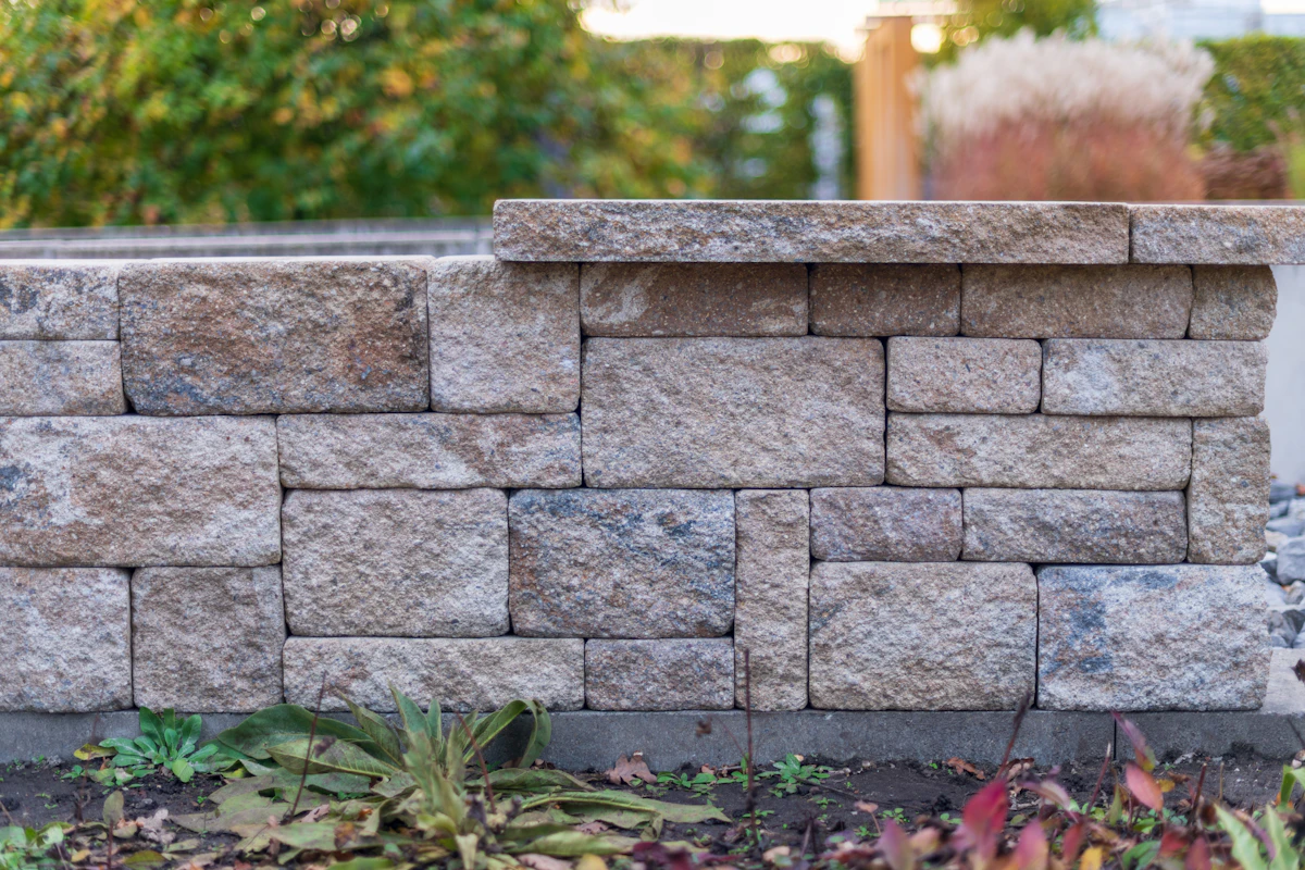 Armour stone wall holding a 1.2m grade change off a Cambridge driveway