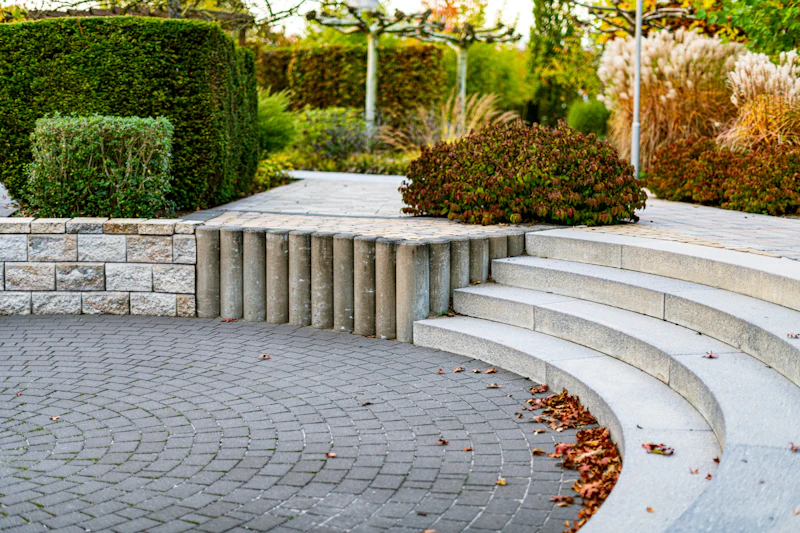 Curved stone steps through a planted garden