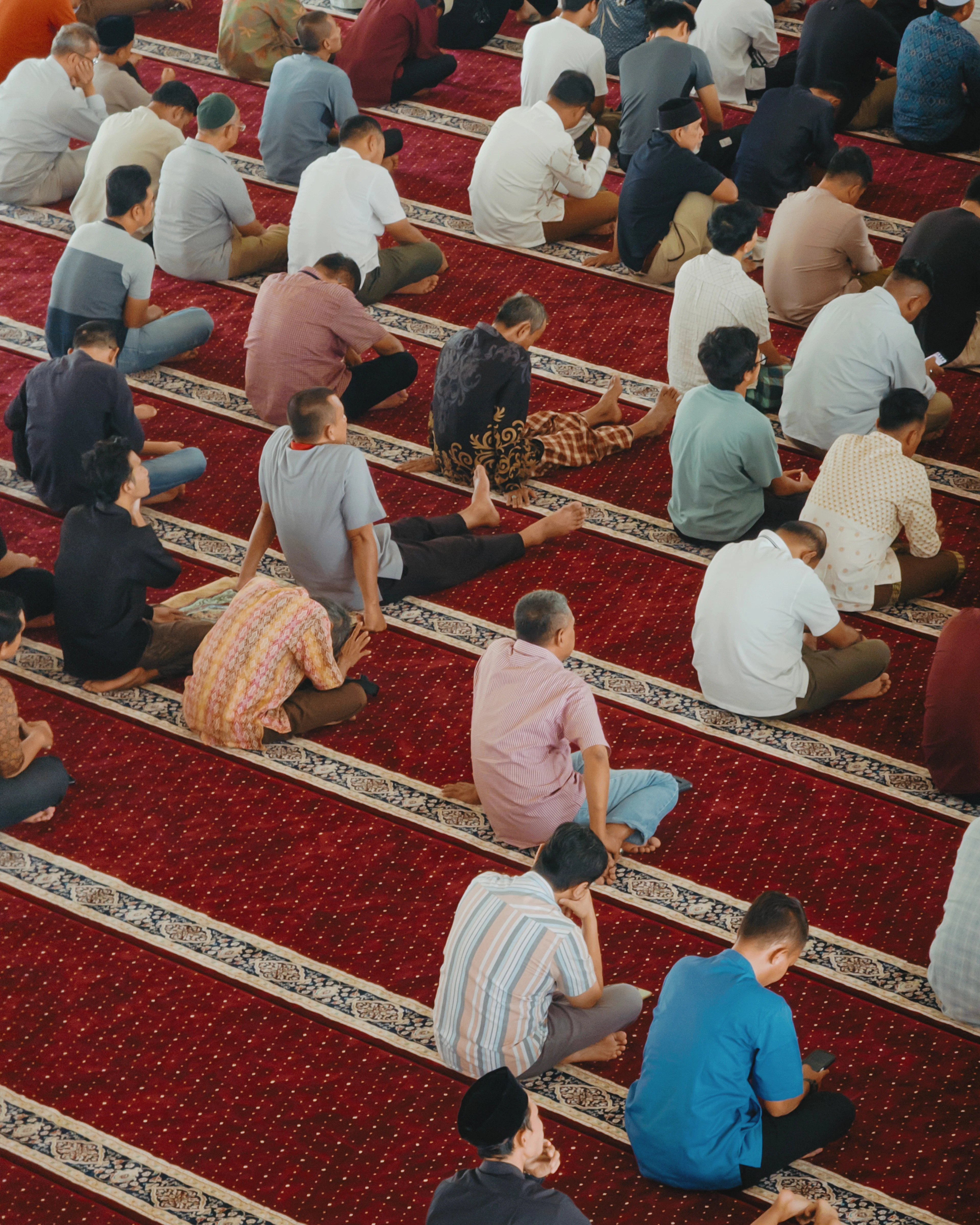 Congregants standing shoulder to shoulder in salah
